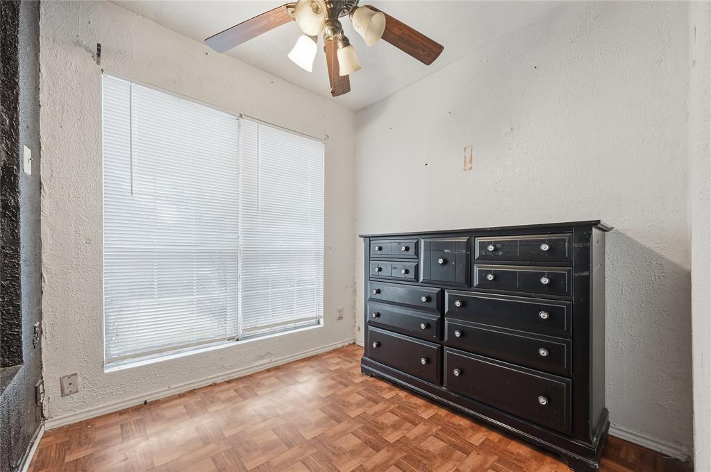 414 Thomas Street Terrell, TX 75160 - Photo 16 of 20 a view of a bedroom with closet and cabinet