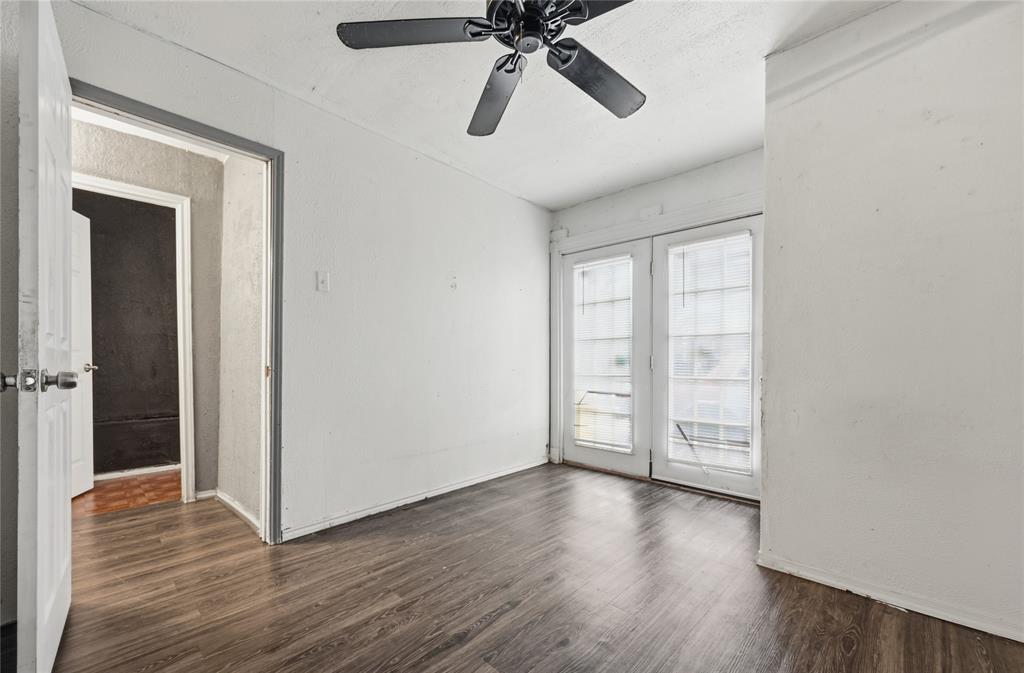 414 Thomas Street Terrell, TX 75160 - Photo 19 of 20 wooden floor in an empty room with a window