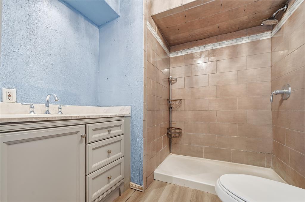 414 Thomas Street Terrell, TX 75160 - Photo 20 of 20 a bathroom with a sink a toilet and shower