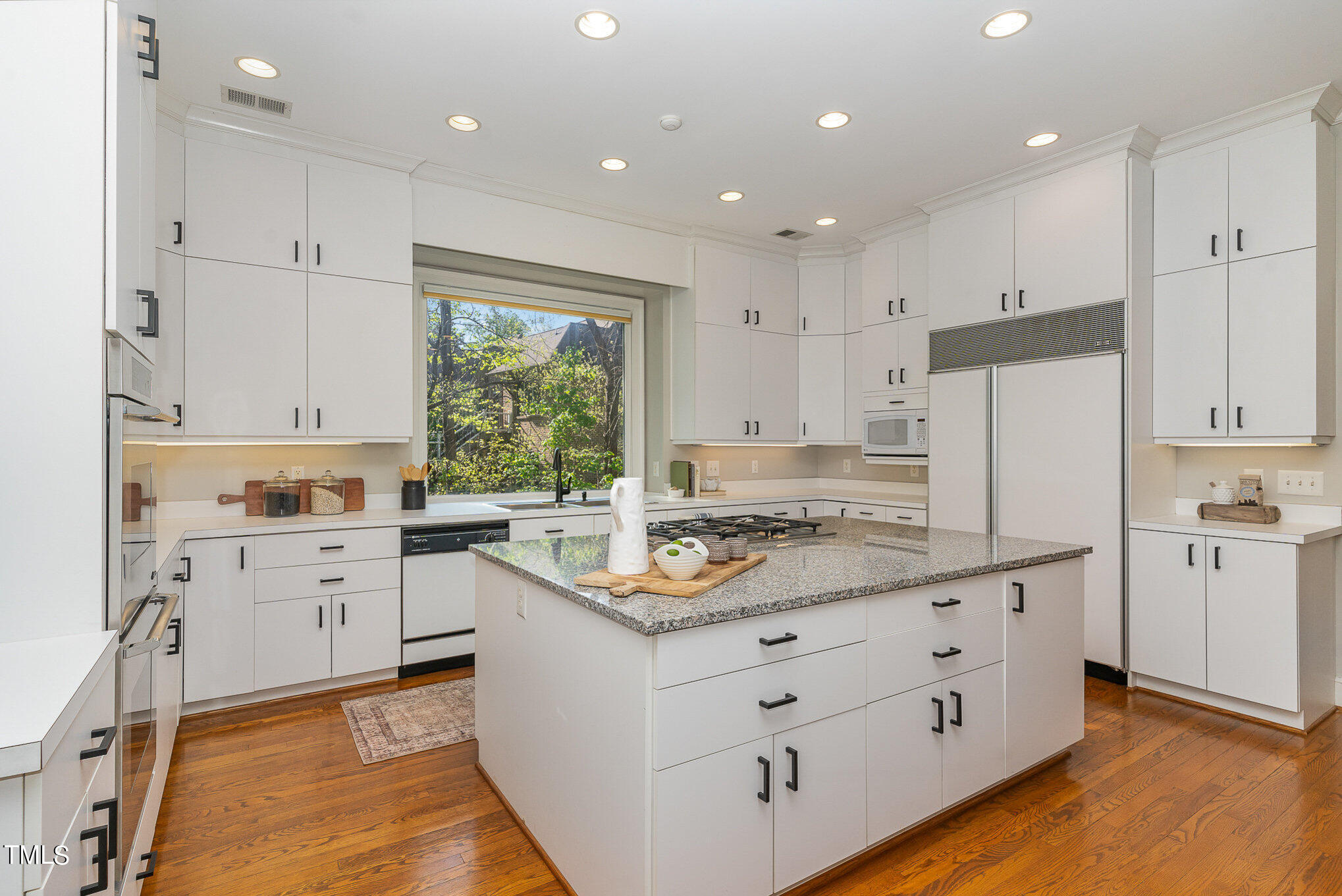3737 Hope Valley Road Durham, NC 27707 - Photo 14 of 58 a kitchen with granite countertop white cabinets white appliances and sink