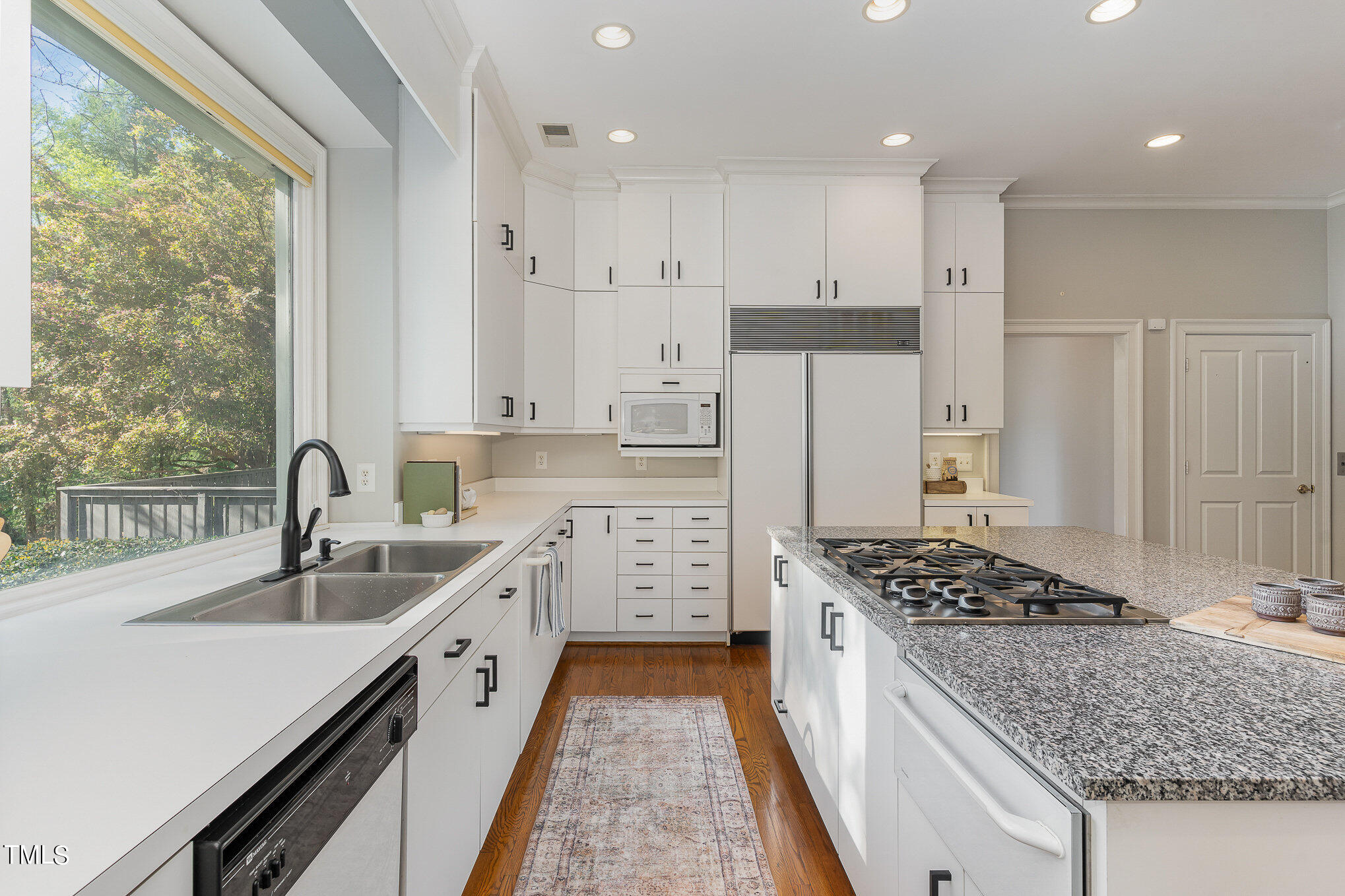 3737 Hope Valley Road Durham, NC 27707 - Photo 16 of 58 a kitchen with stainless steel appliances granite countertop a sink stove and refrigerator