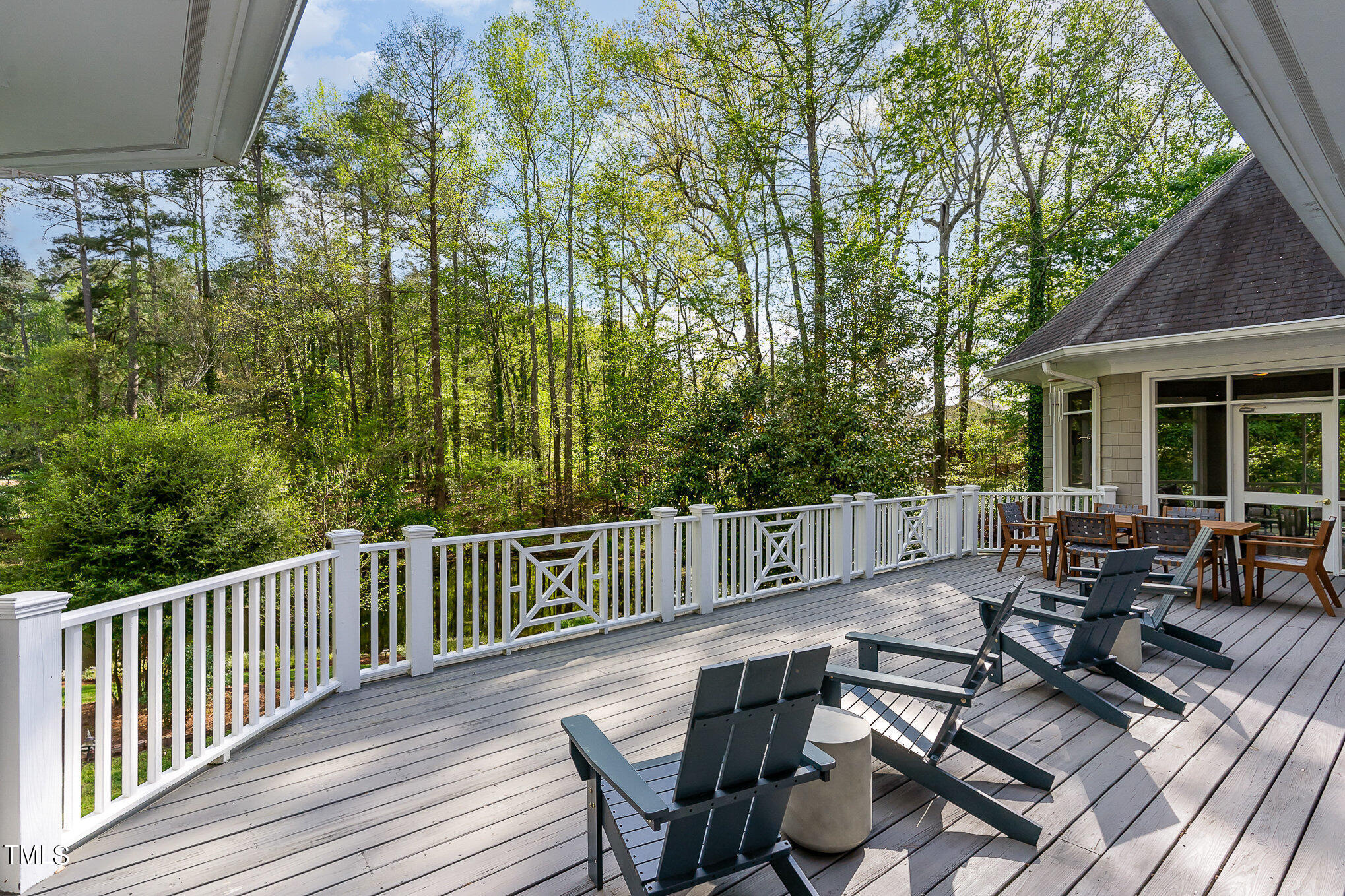 3737 Hope Valley Road Durham, NC 27707 - Photo 19 of 58 a view of a patio with two chairs and table on the wooden floor