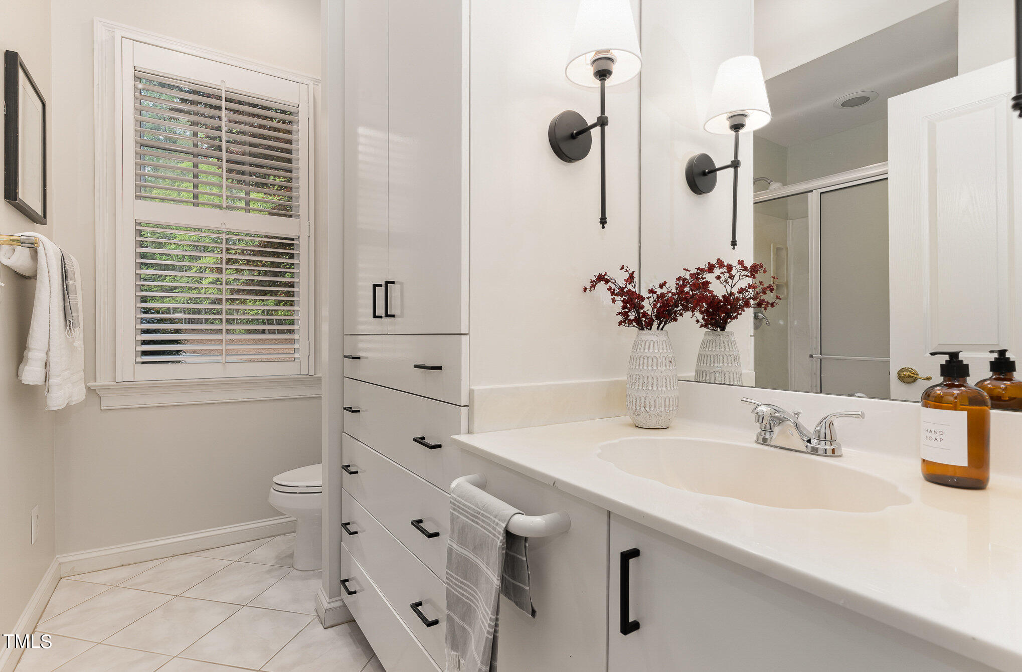 3737 Hope Valley Road Durham, NC 27707 - Photo 28 of 58 a bathroom with a tub sink and mirror