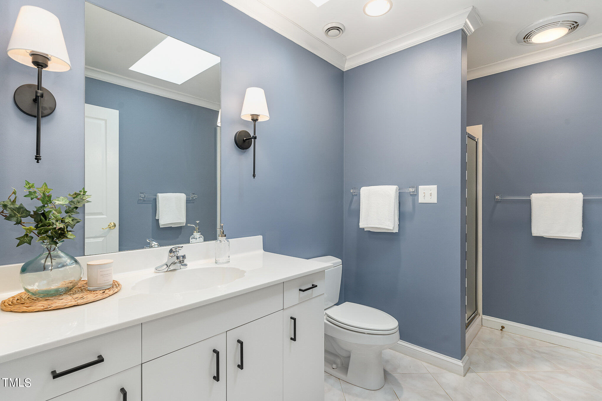 3737 Hope Valley Road Durham, NC 27707 - Photo 32 of 58 a bathroom with a sink a toilet and mirror