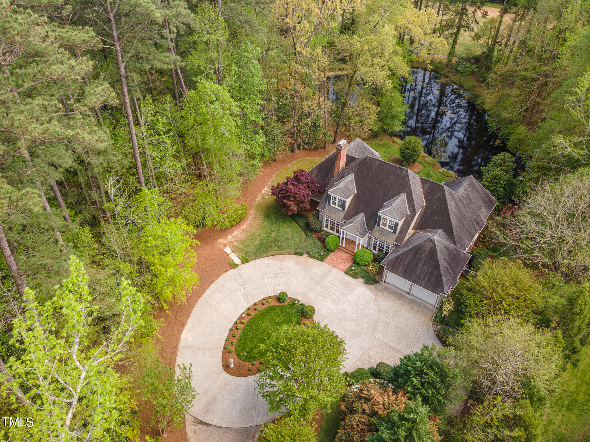 3737 Hope Valley Road Durham, NC 27707 - Photo 4 of 58 an aerial view of a house with a yard and trees all around
