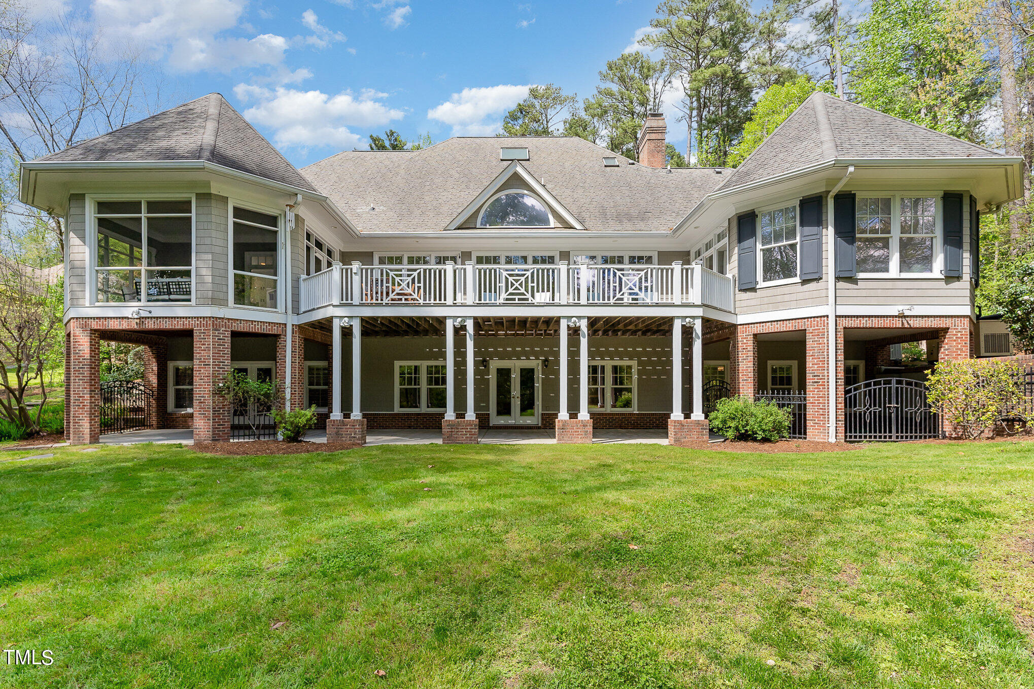 3737 Hope Valley Road Durham, NC 27707 - Photo 48 of 58 a view of a white building with a big yard and potted plants