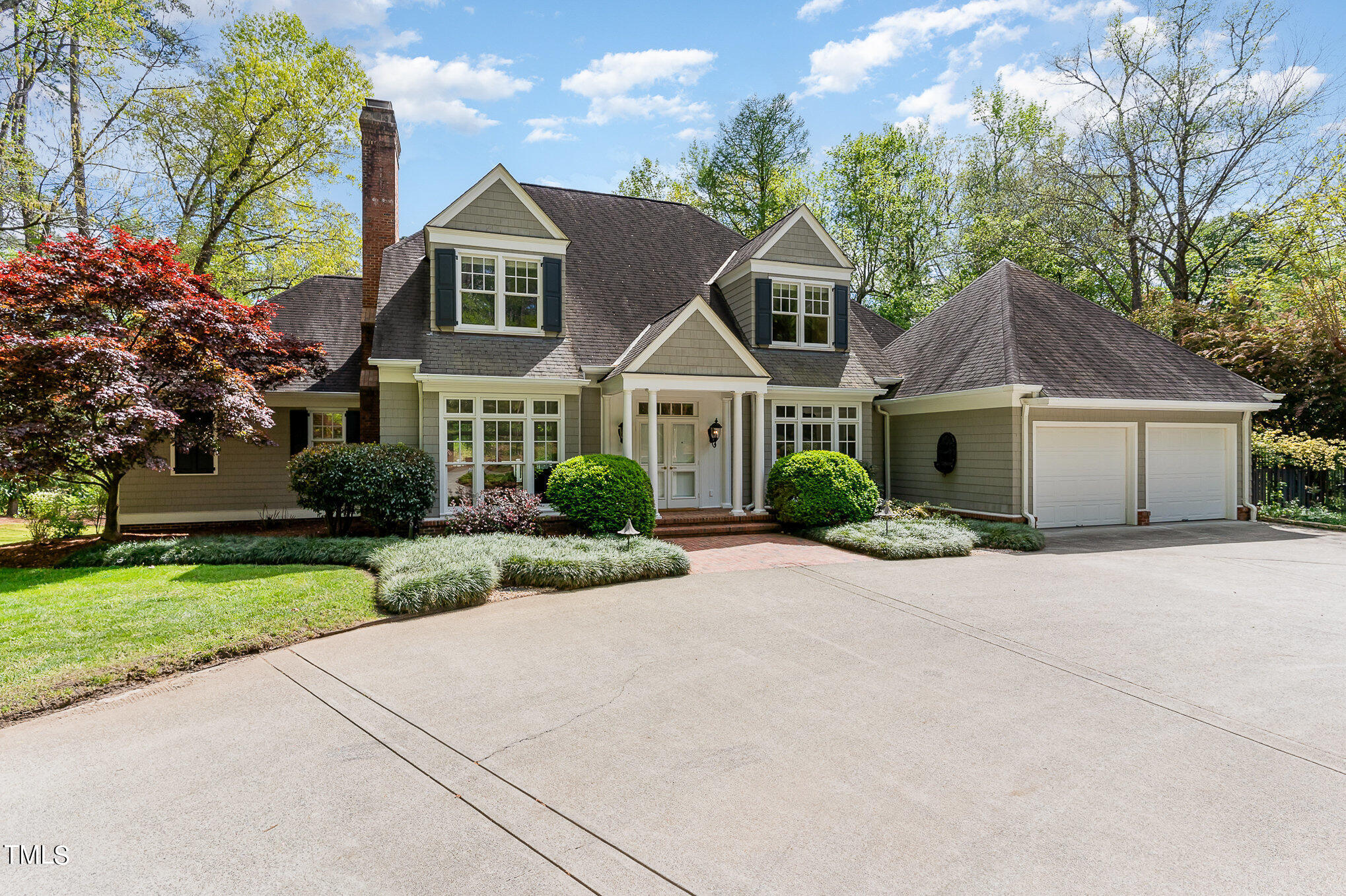 3737 Hope Valley Road Durham, NC 27707 - Photo 5 of 58 a front view of a house with a yard and garage