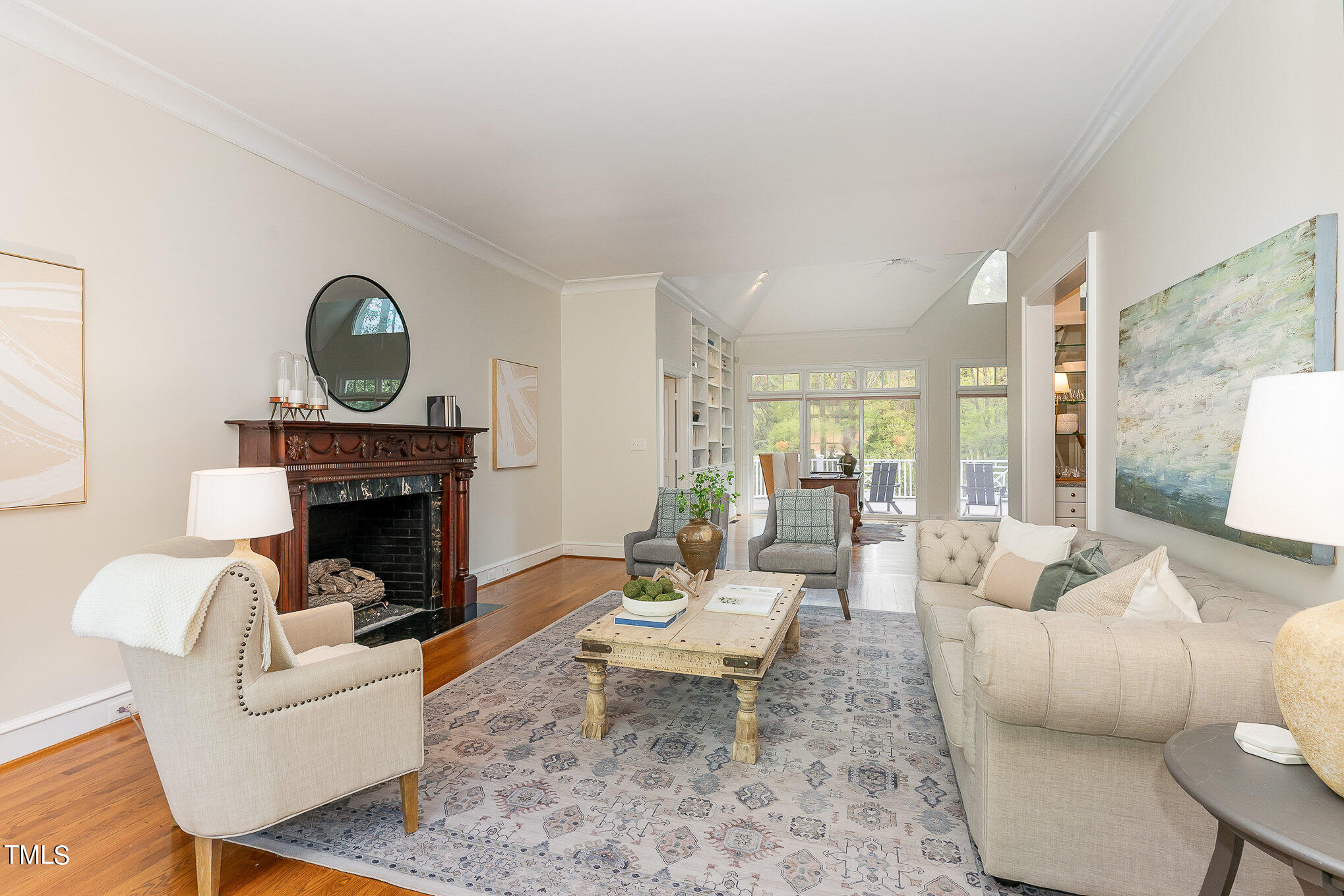 3737 Hope Valley Road Durham, NC 27707 - Photo 6 of 58 a living room with furniture a fireplace and a table