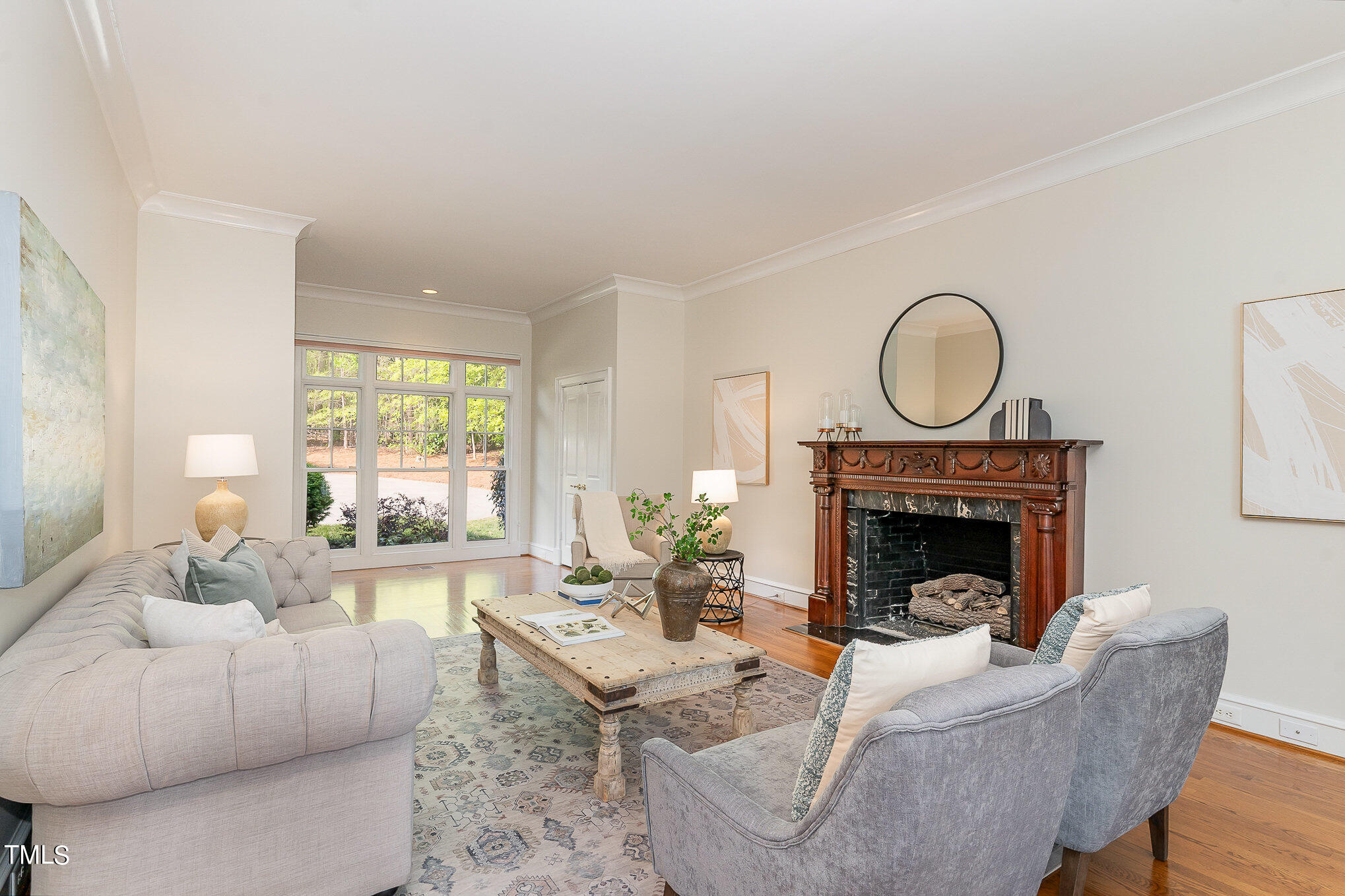 3737 Hope Valley Road Durham, NC 27707 - Photo 7 of 58 a living room with furniture a fireplace and a large window
