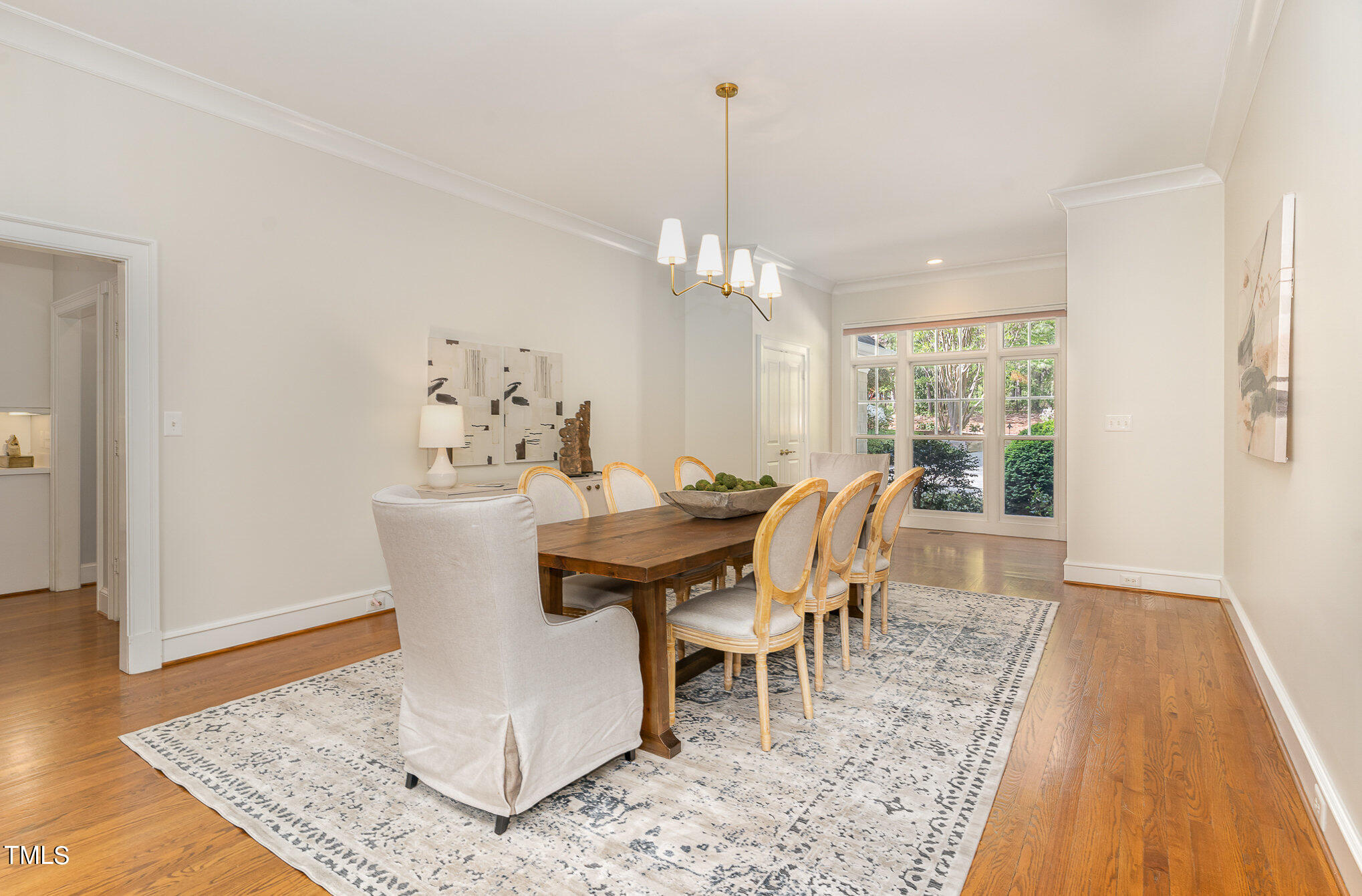 3737 Hope Valley Road Durham, NC 27707 - Photo 10 of 58 a dining room with furniture a rug and wooden floor