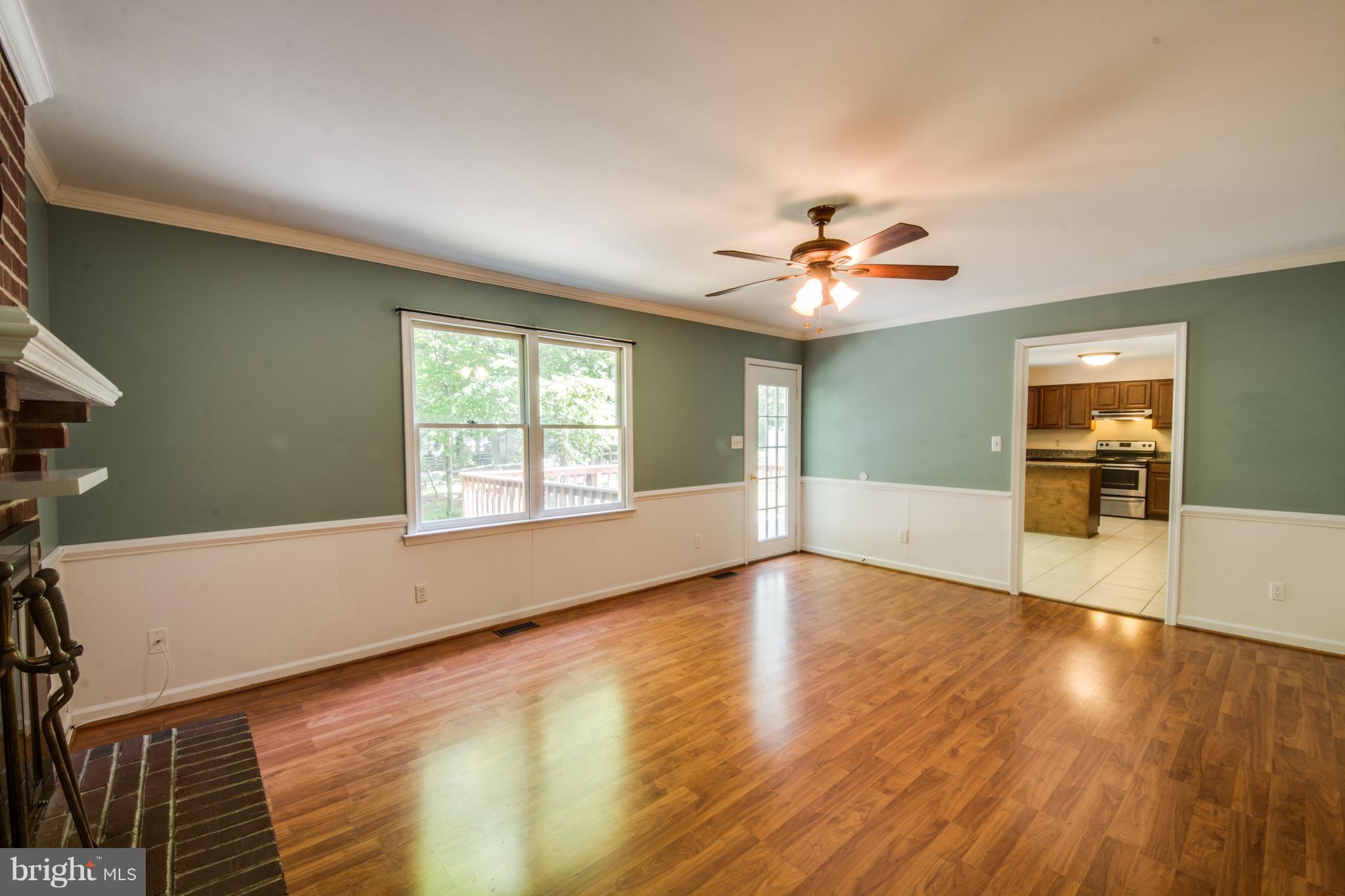 414 Ferry Road Fredericksburg, VA 22405 - Photo 11 of 28 a view of an empty room with window and wooden floor