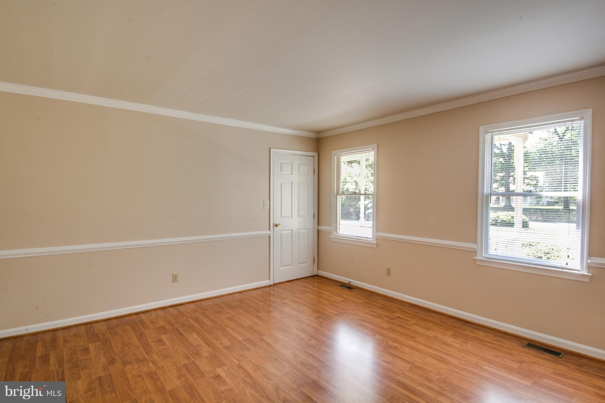 414 Ferry Road Fredericksburg, VA 22405 - Photo 13 of 28 an empty room with wooden floor and windows