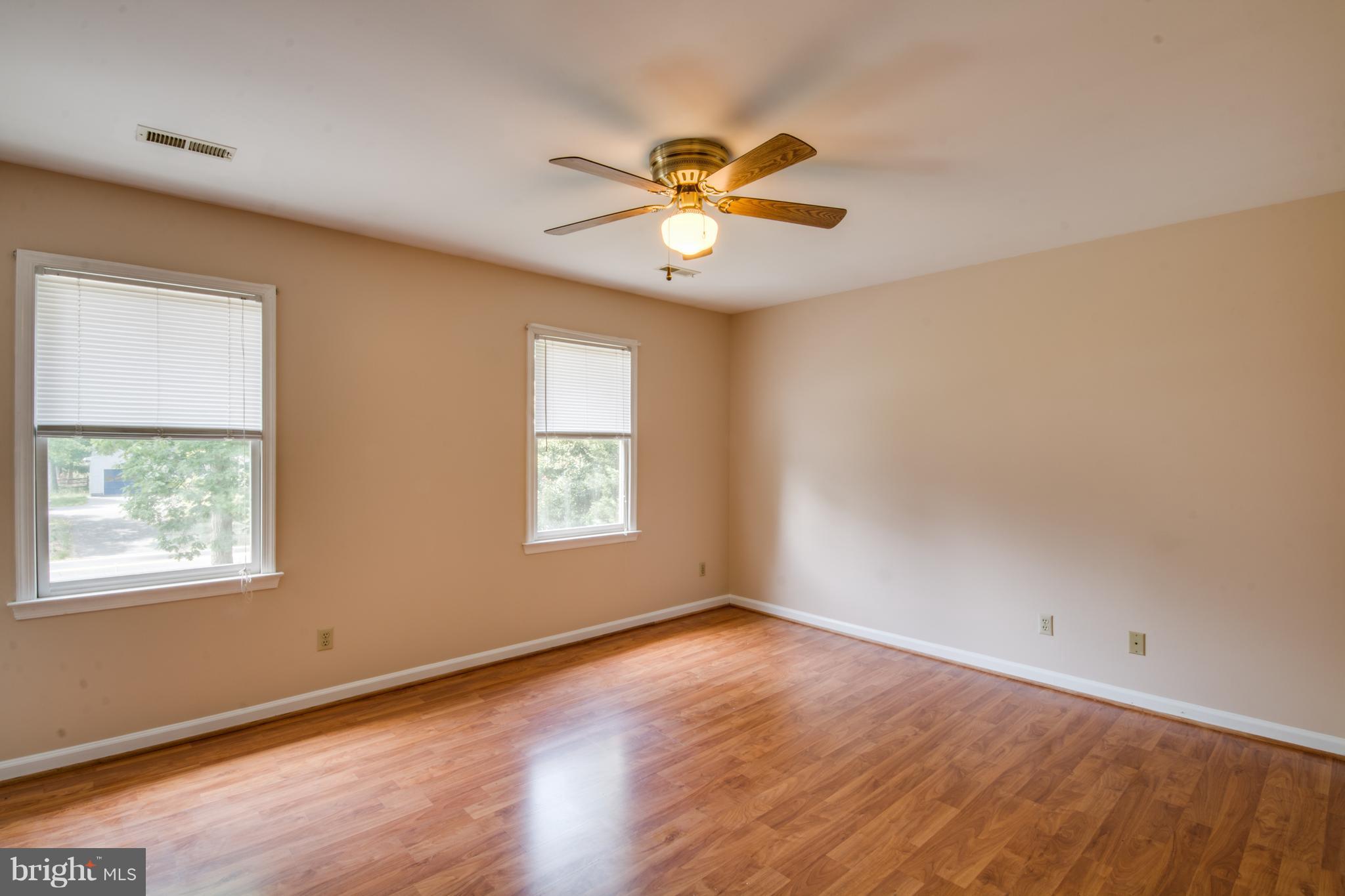 414 Ferry Road Fredericksburg, VA 22405 - Photo 14 of 28 a view of an empty room with window and wooden floor