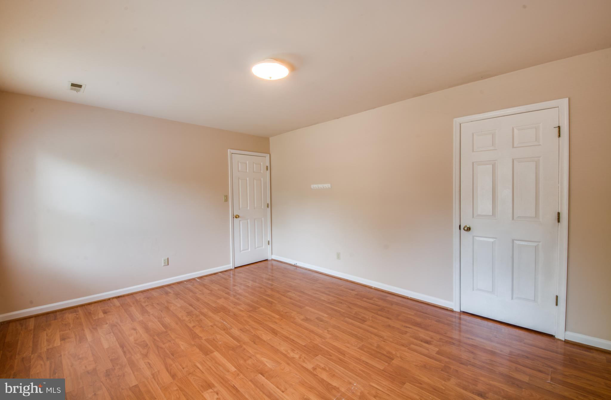 414 Ferry Road Fredericksburg, VA 22405 - Photo 21 of 28 a view of an empty room with wooden floor