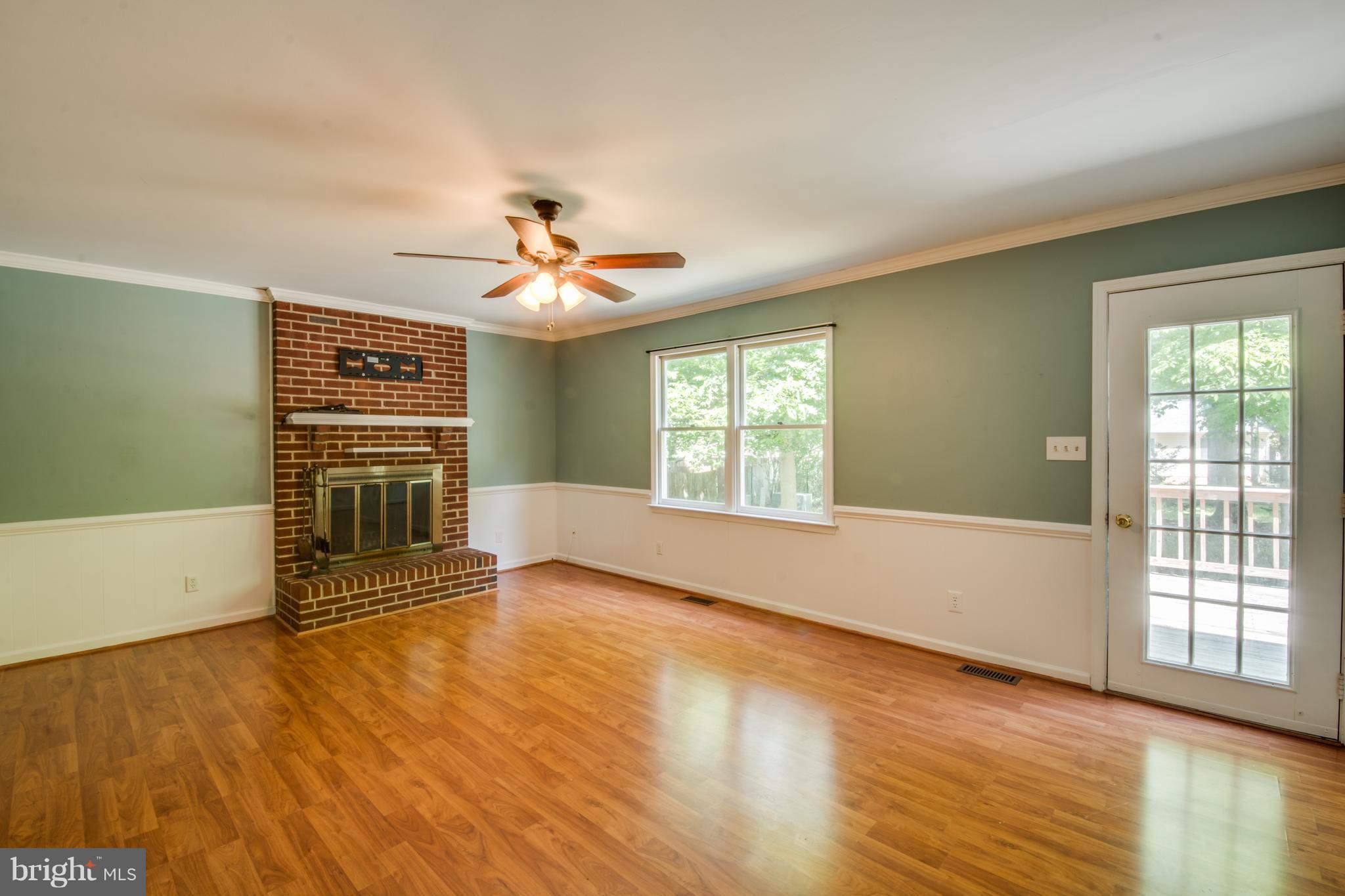 414 Ferry Road Fredericksburg, VA 22405 - Photo 10 of 28 a view of an empty room with a window and wooden floor