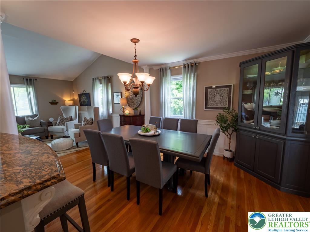 2087 Hopewell Road Bethlehem, PA 18017 - Photo 14 of 38 Hardwood floors and crown molding elevate this open concept dining area, ideal for entertaining.