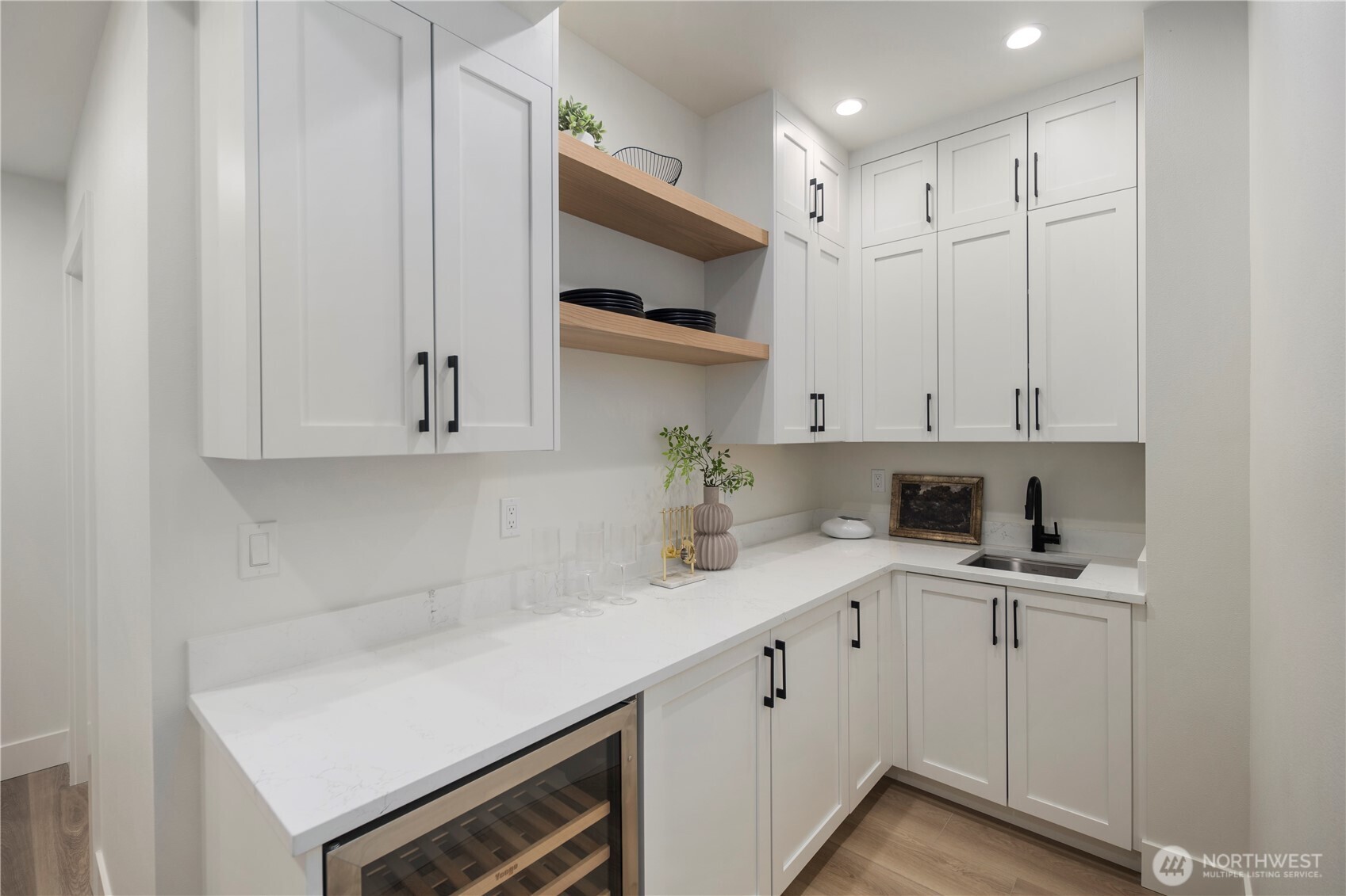 19926 68th Avenue Northeast Kenmore, WA 98028 - Photo 34 of 39 a kitchen with white cabinets and sink