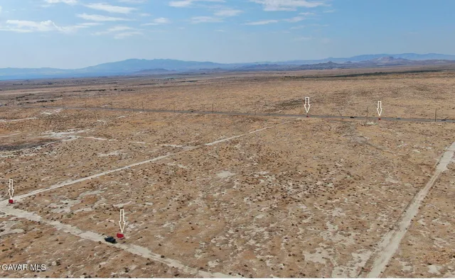 a view of an ocean beach and mountain