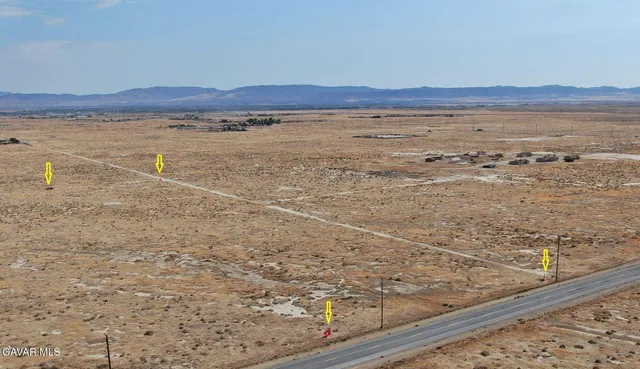 a view of an ocean beach and mountain