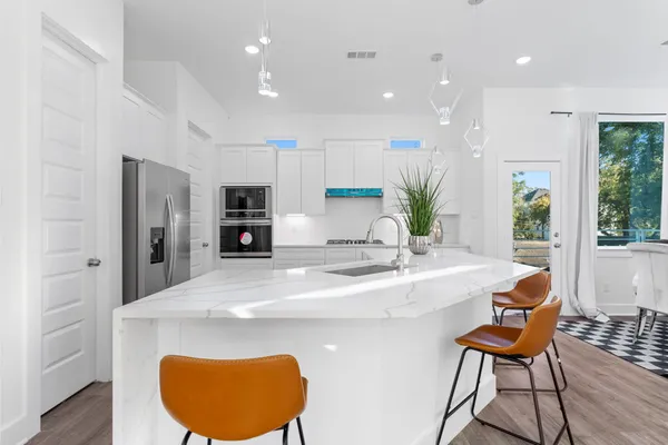 a kitchen with a table and chairs in it