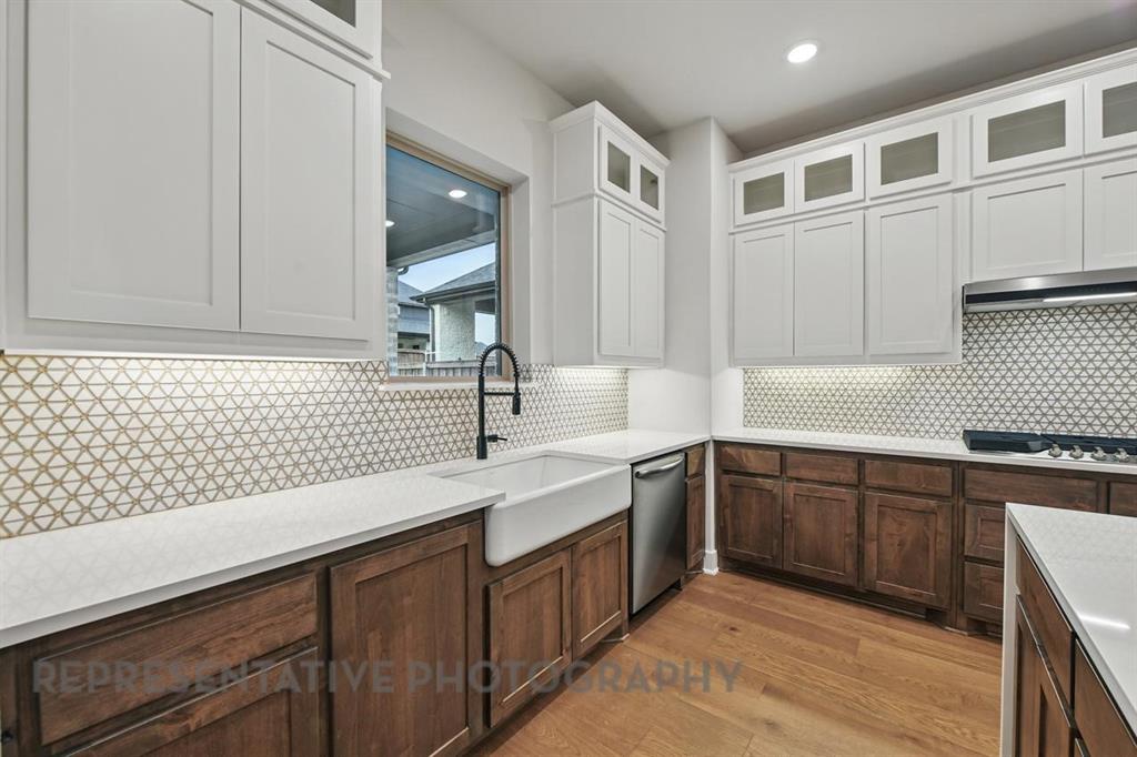 2716 Railway Street Forney, TX 75126 - Photo 5 of 25 a kitchen with a sink and cabinets