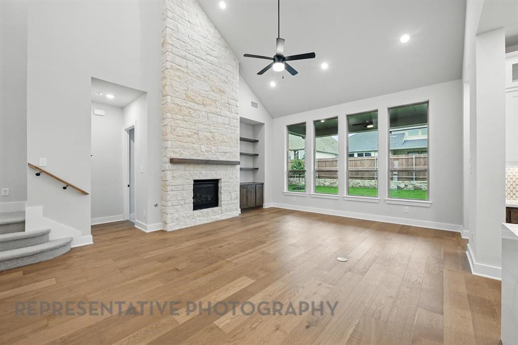 2716 Railway Street Forney, TX 75126 - Photo 8 of 25 a view of an empty room with a fireplace and a window