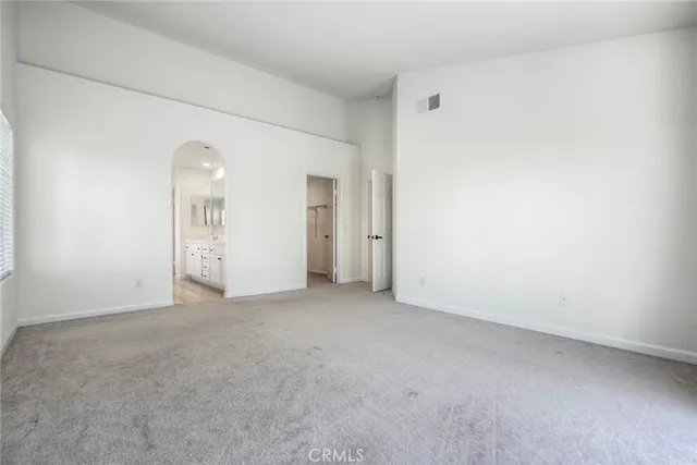 an empty room with closet area