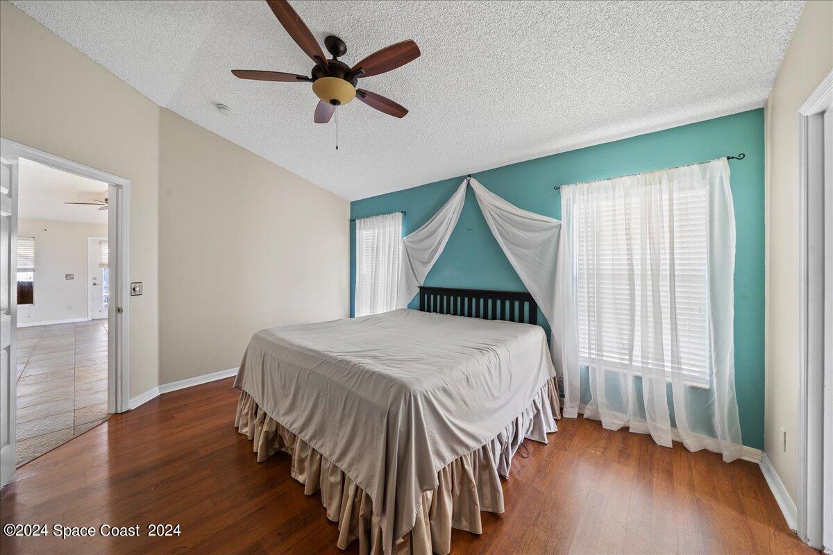 4850 Decatur Circle Melbourne, FL 32934 - Photo 15 of 35 a bedroom with a bed and a window