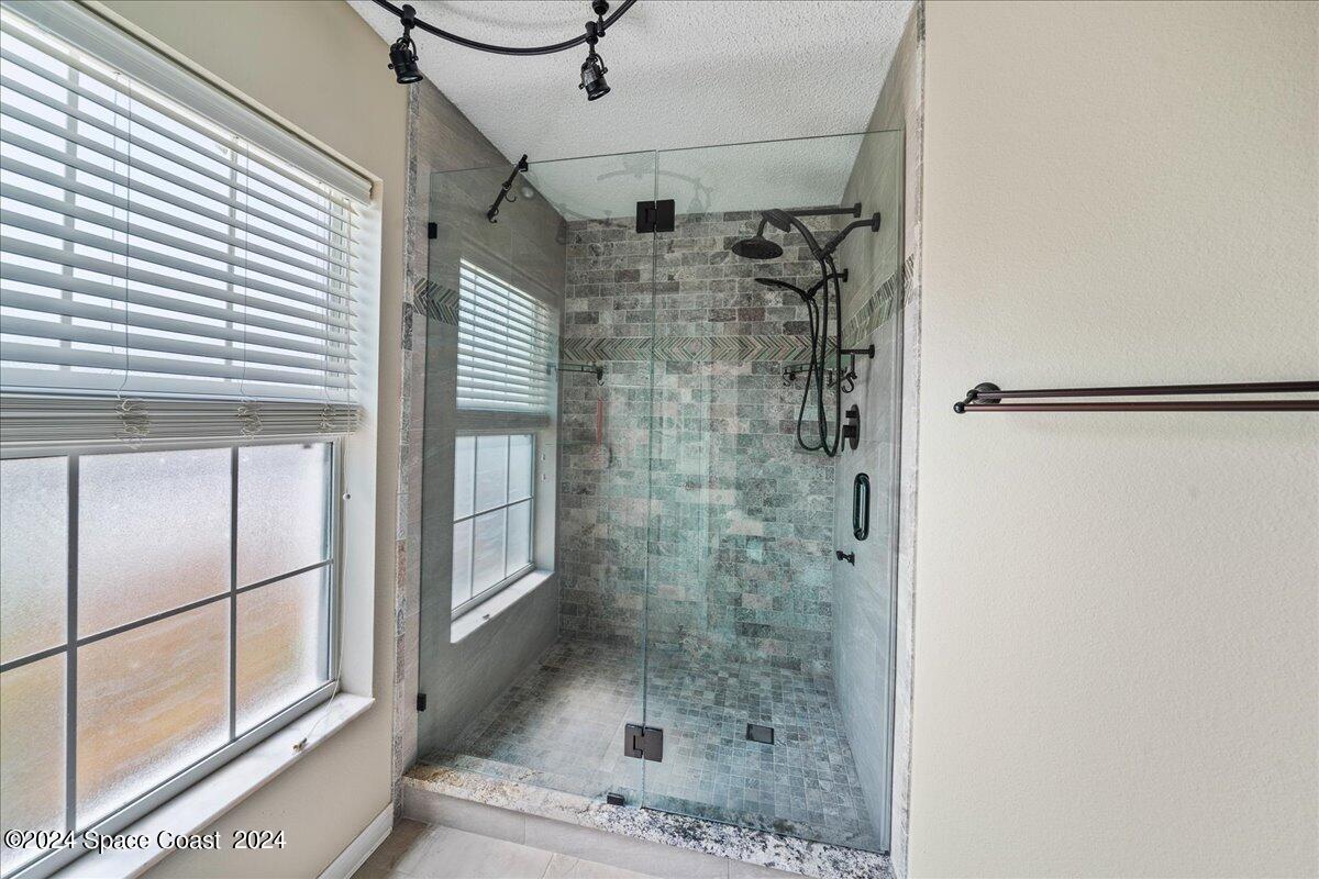 4850 Decatur Circle Melbourne, FL 32934 - Photo 19 of 35 a bathroom with a shower