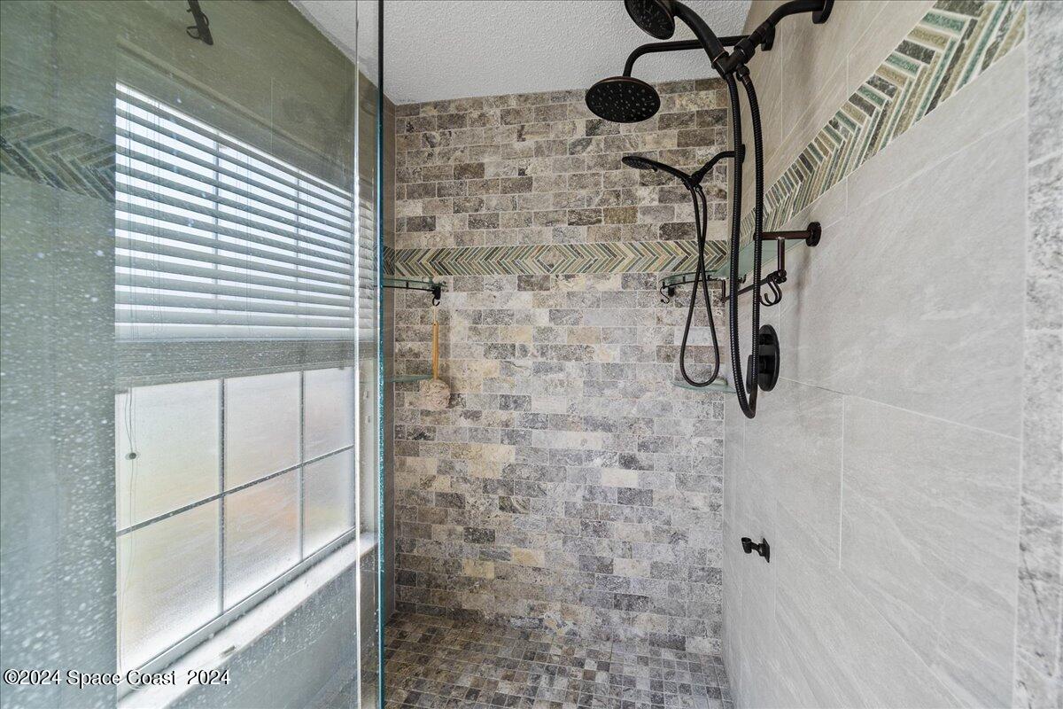 4850 Decatur Circle Melbourne, FL 32934 - Photo 20 of 35 a bathroom with a shower