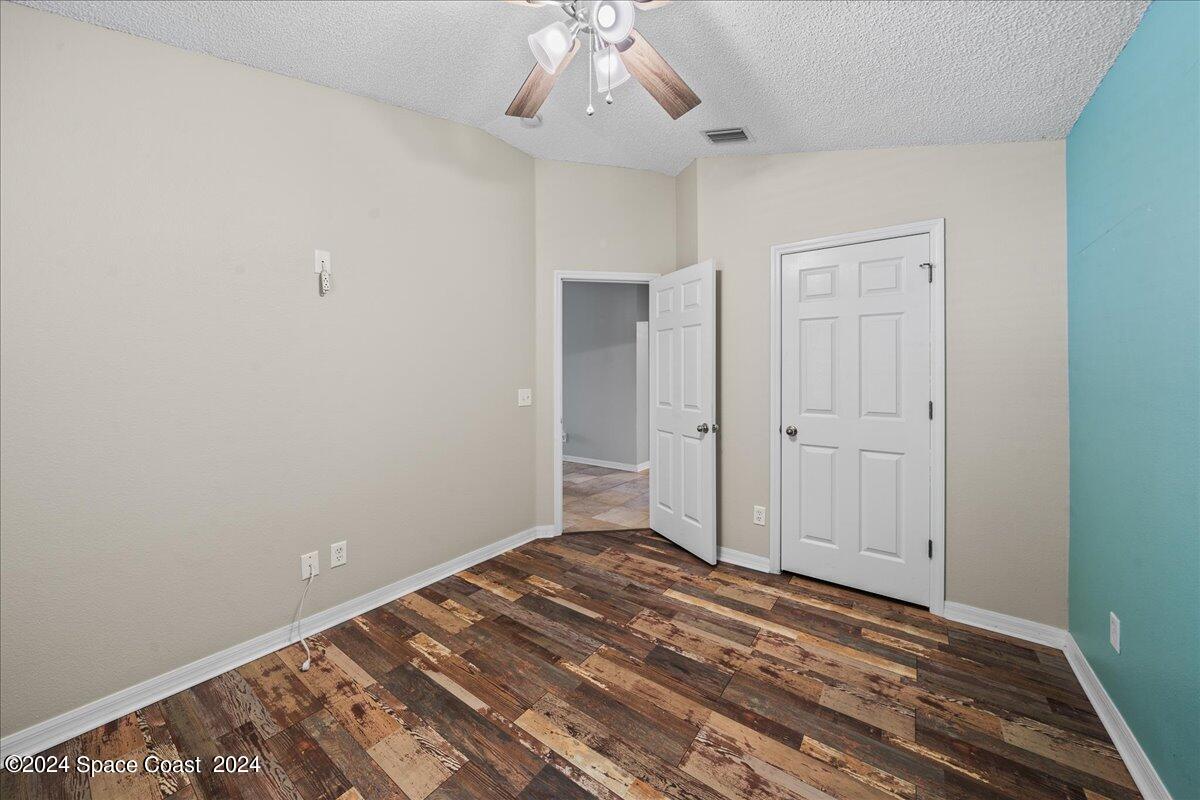 4850 Decatur Circle Melbourne, FL 32934 - Photo 24 of 35 a view of a room with wooden floor and closet