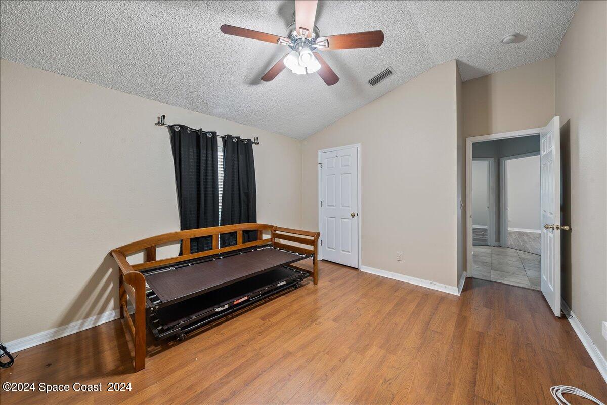 4850 Decatur Circle Melbourne, FL 32934 - Photo 26 of 35 a room with furniture and wooden floor