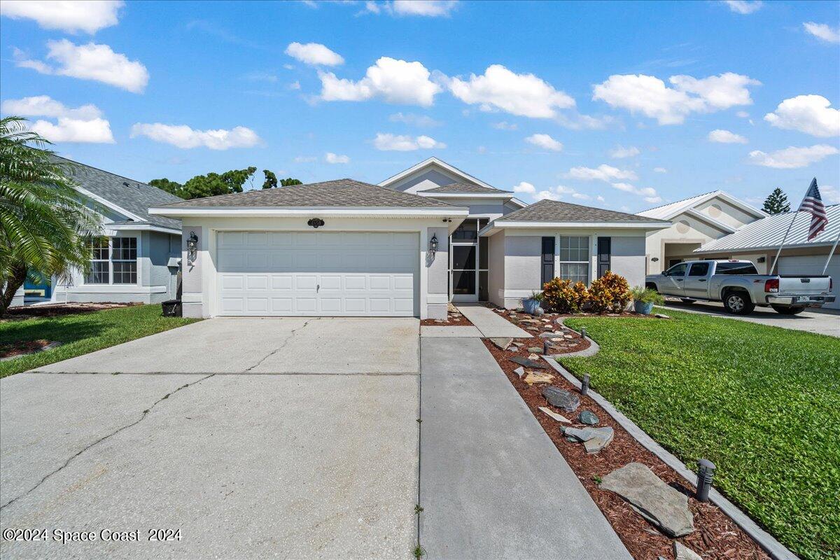 4850 Decatur Circle Melbourne, FL 32934 - Photo 3 of 35 a front view of house with yard