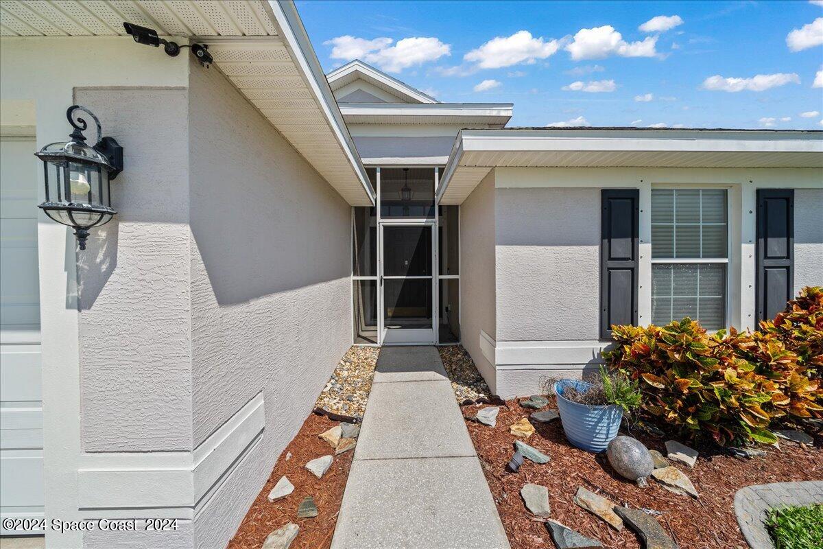 4850 Decatur Circle Melbourne, FL 32934 - Photo 4 of 35 a view of a entryway door front of house