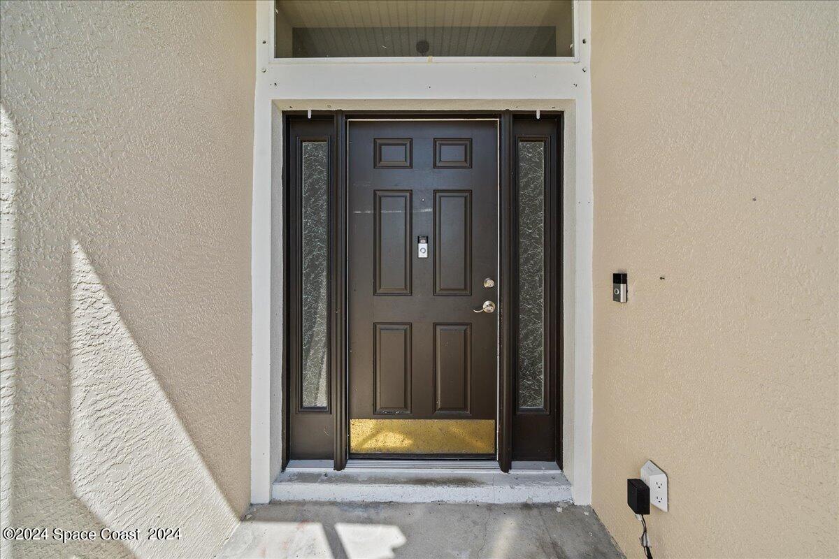 4850 Decatur Circle Melbourne, FL 32934 - Photo 5 of 35 a view of front door of house