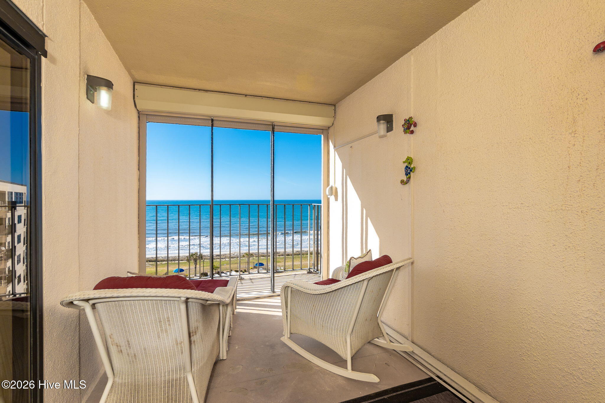 1505 Salter Path Road, Unit 603J Indian Beach, NC 28512 - Photo 32 of 50 Smaller covered deck for all weather enjoyment