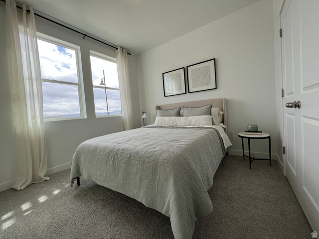 718 West Blue Magic Lane, Unit S201 Midvale, UT 84047 - Photo 6 of 18 Carpeted bedroom with baseboards