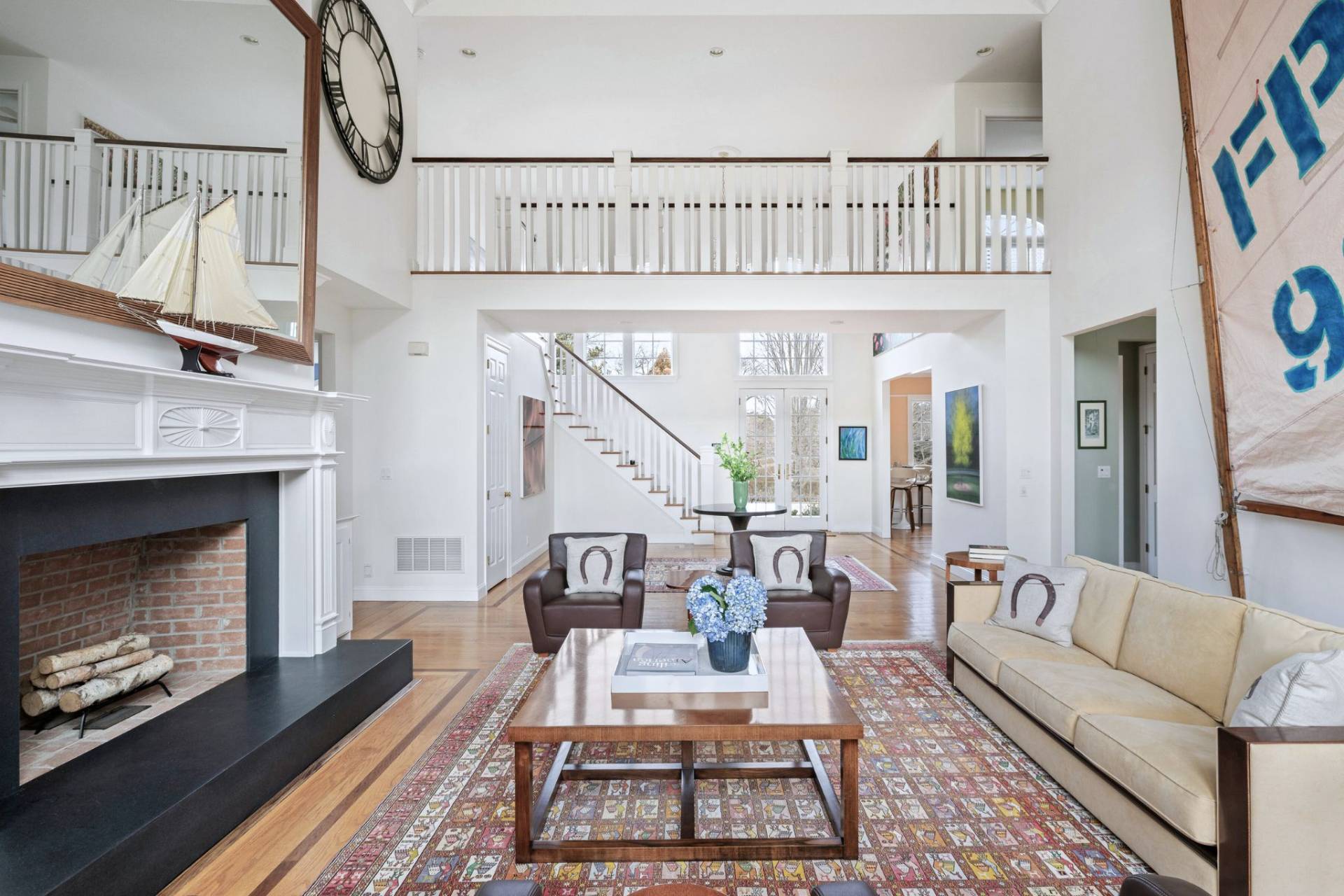 99 Flying Point Road Southampton, NY 11968 - Photo 7 of 20 a living room with furniture a fireplace and a rug
