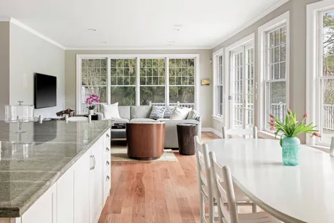 a view of a living room and dining room