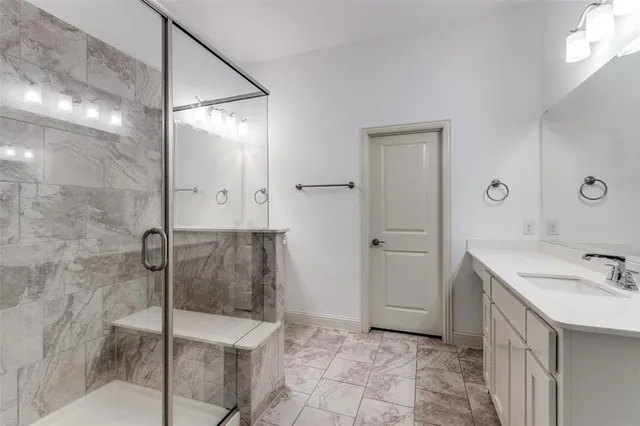 a bathroom with a sink and mirror