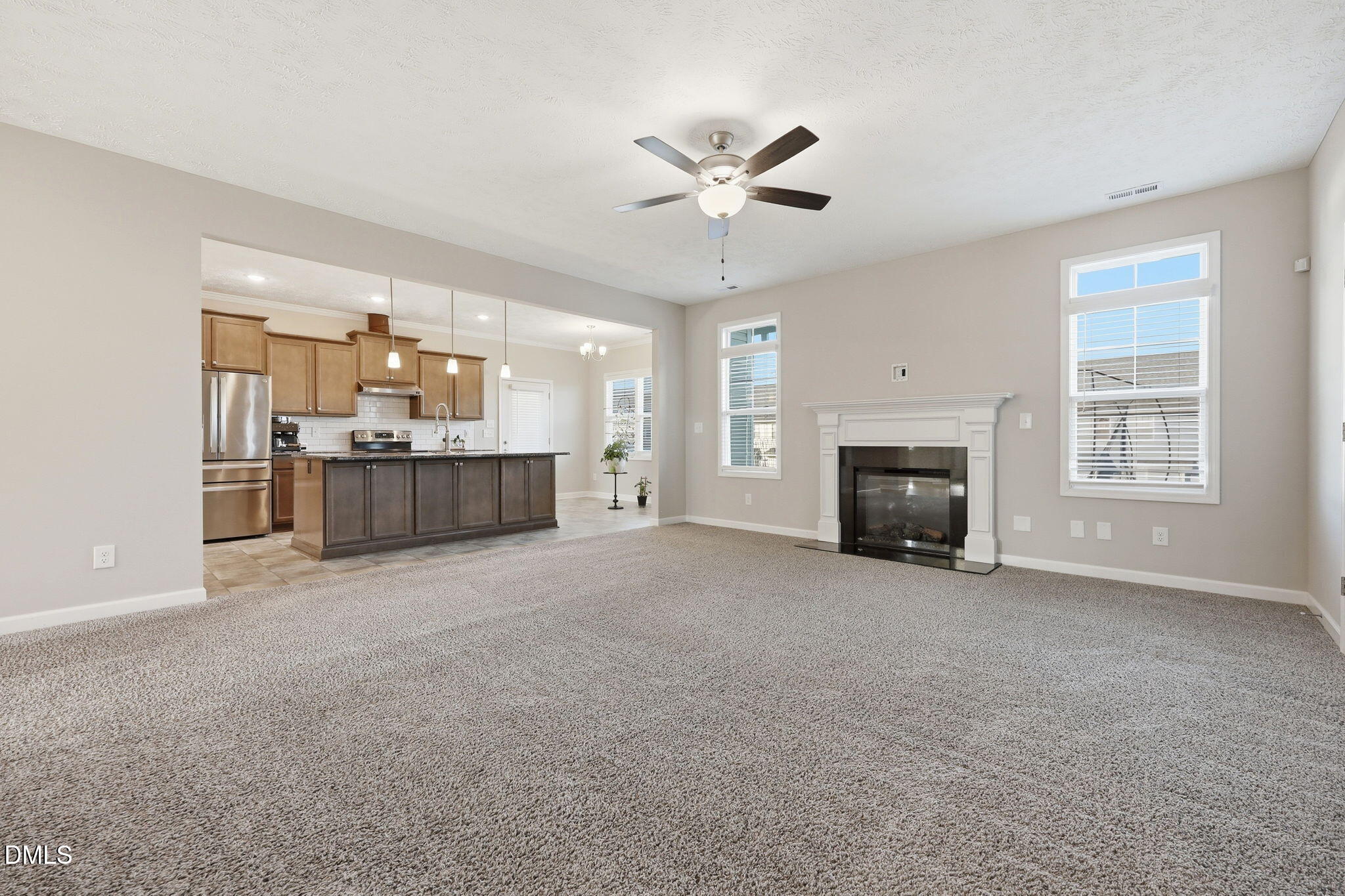 3017 Branscombe Road Fayetteville, NC 28304 - Photo 10 of 43 a view of a livingroom with a fireplace a sink and dishwasher kitchen view
