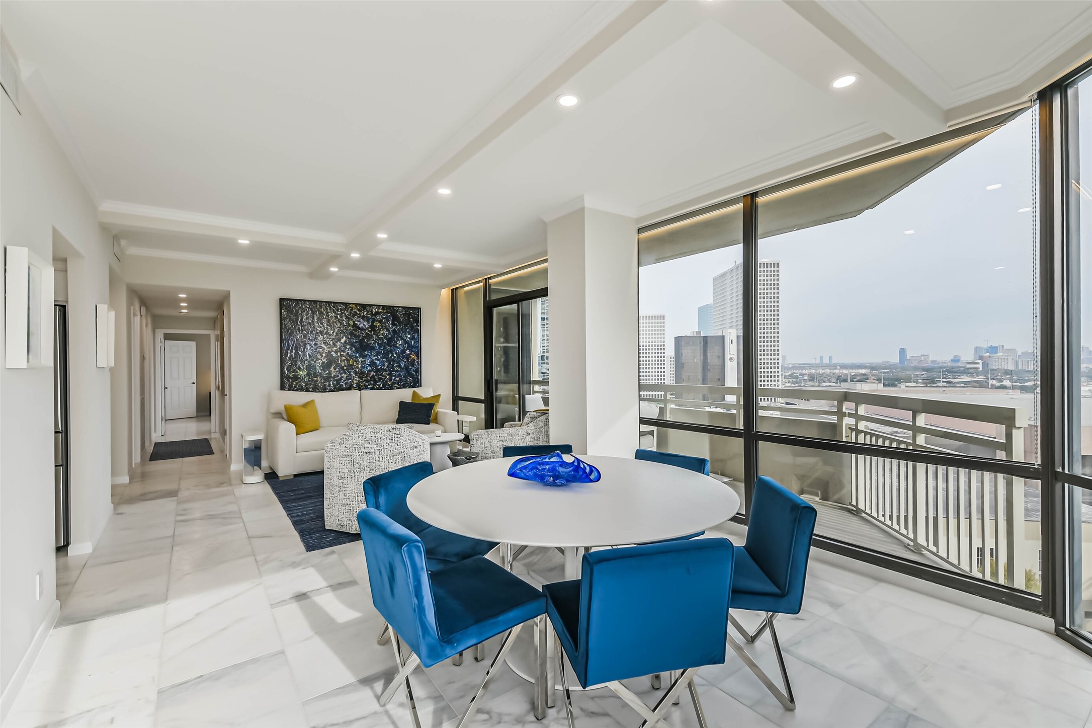 14 Greenway Plaza, Unit 15P Houston, TX 77046 - Photo 4 of 25 a view of a dining room with furniture large windows and wooden floor
