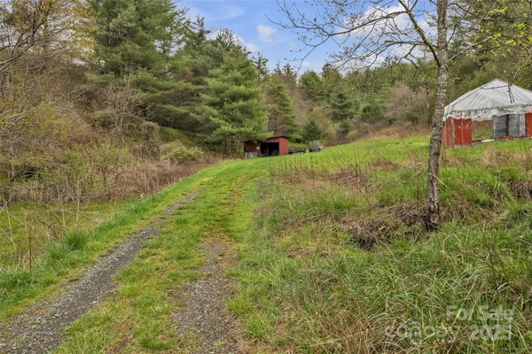 a view of a garden with a building