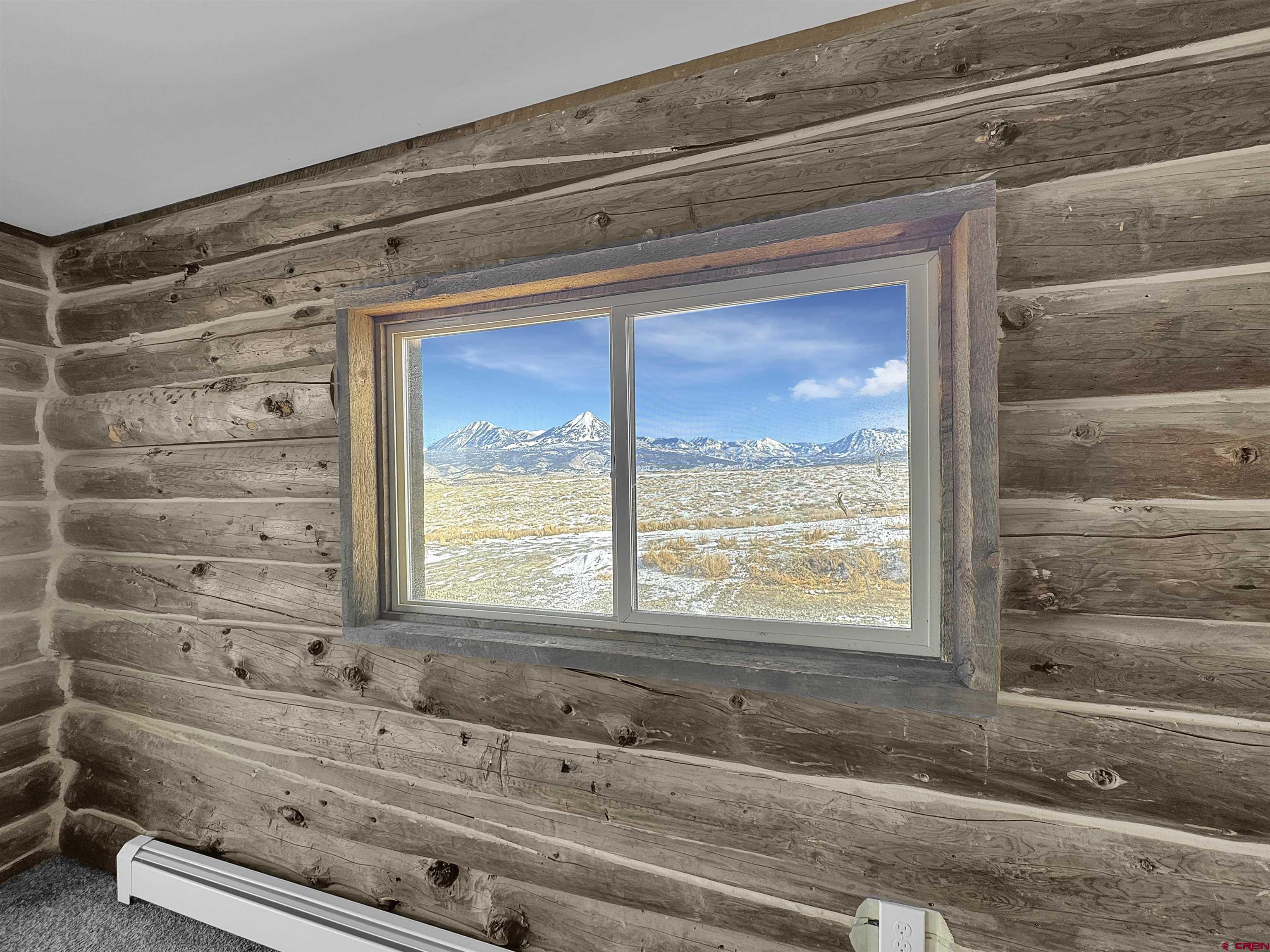 6313 Sagebrush Road Hotchkiss, CO 81419 - Photo 11 of 34 a bathroom with a bathtub and a window