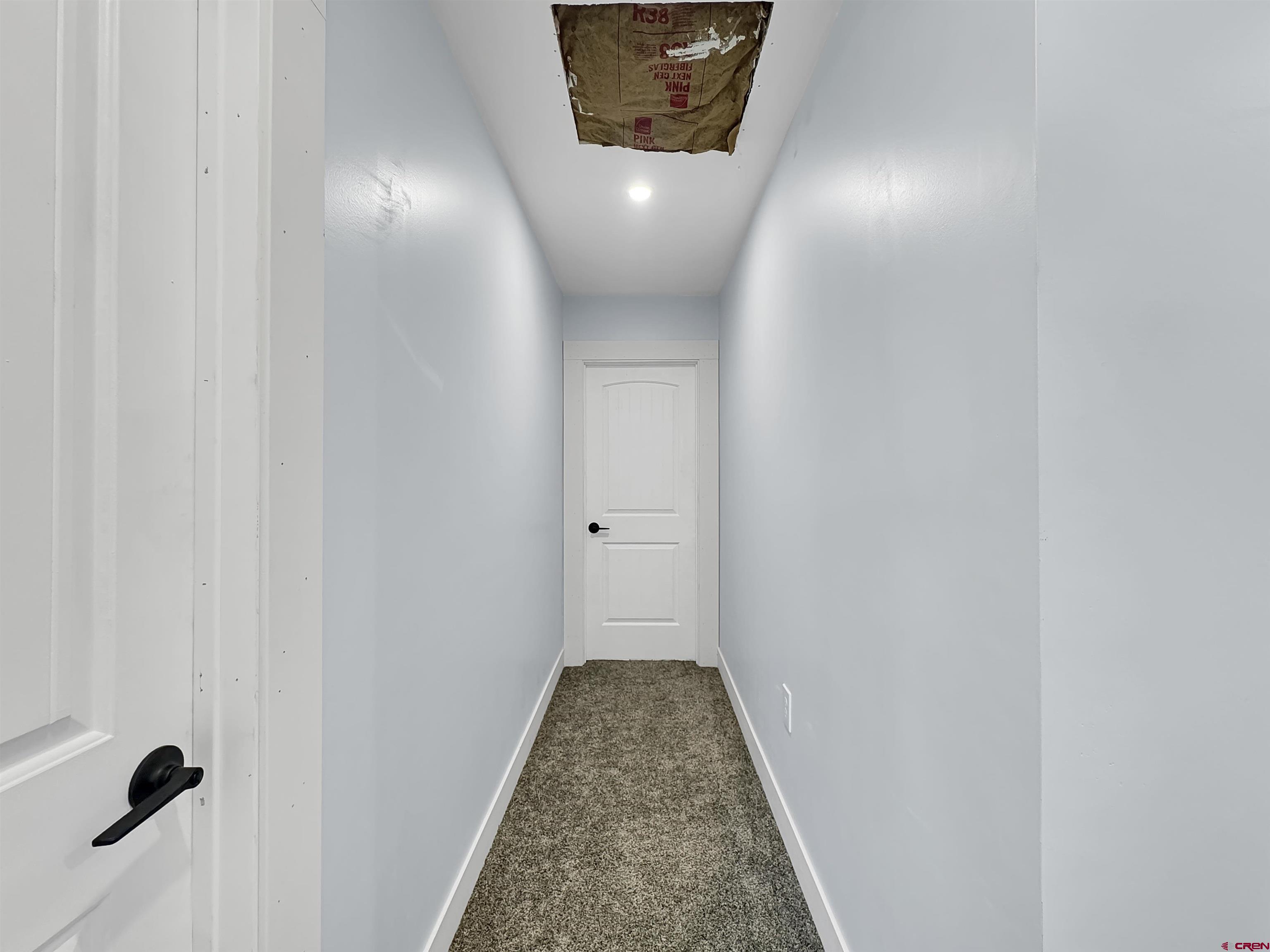 6313 Sagebrush Road Hotchkiss, CO 81419 - Photo 13 of 34 a view of a hallway with wooden floor