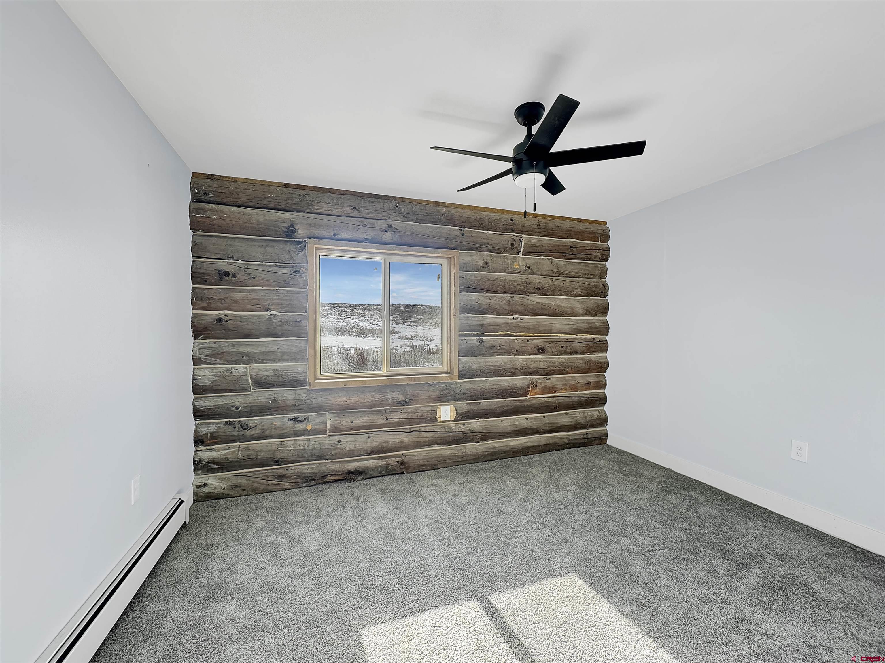 6313 Sagebrush Road Hotchkiss, CO 81419 - Photo 15 of 34 a view of room with stairs and a ceiling fan