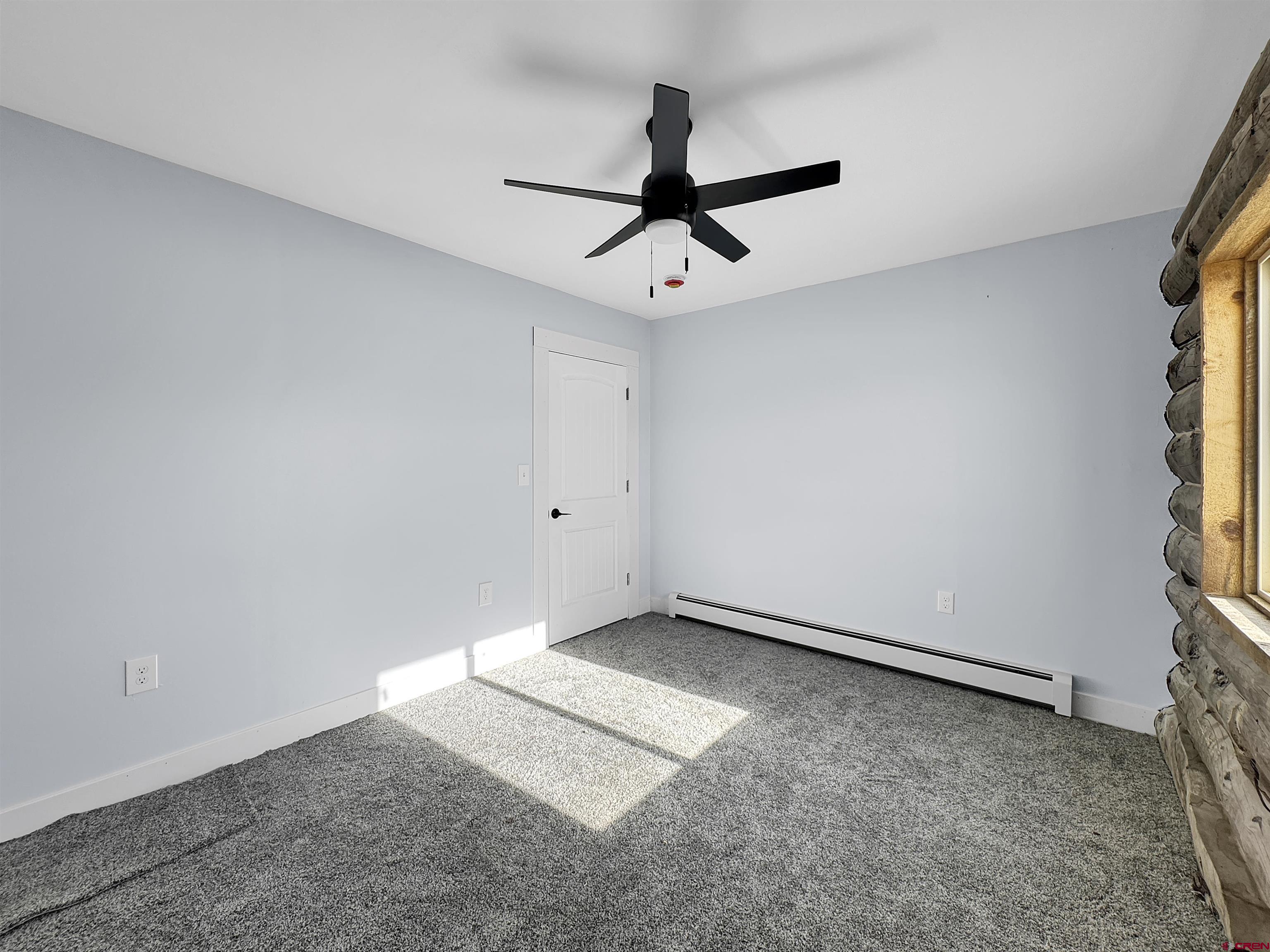 6313 Sagebrush Road Hotchkiss, CO 81419 - Photo 16 of 34 an empty room with a window and a ceiling fan