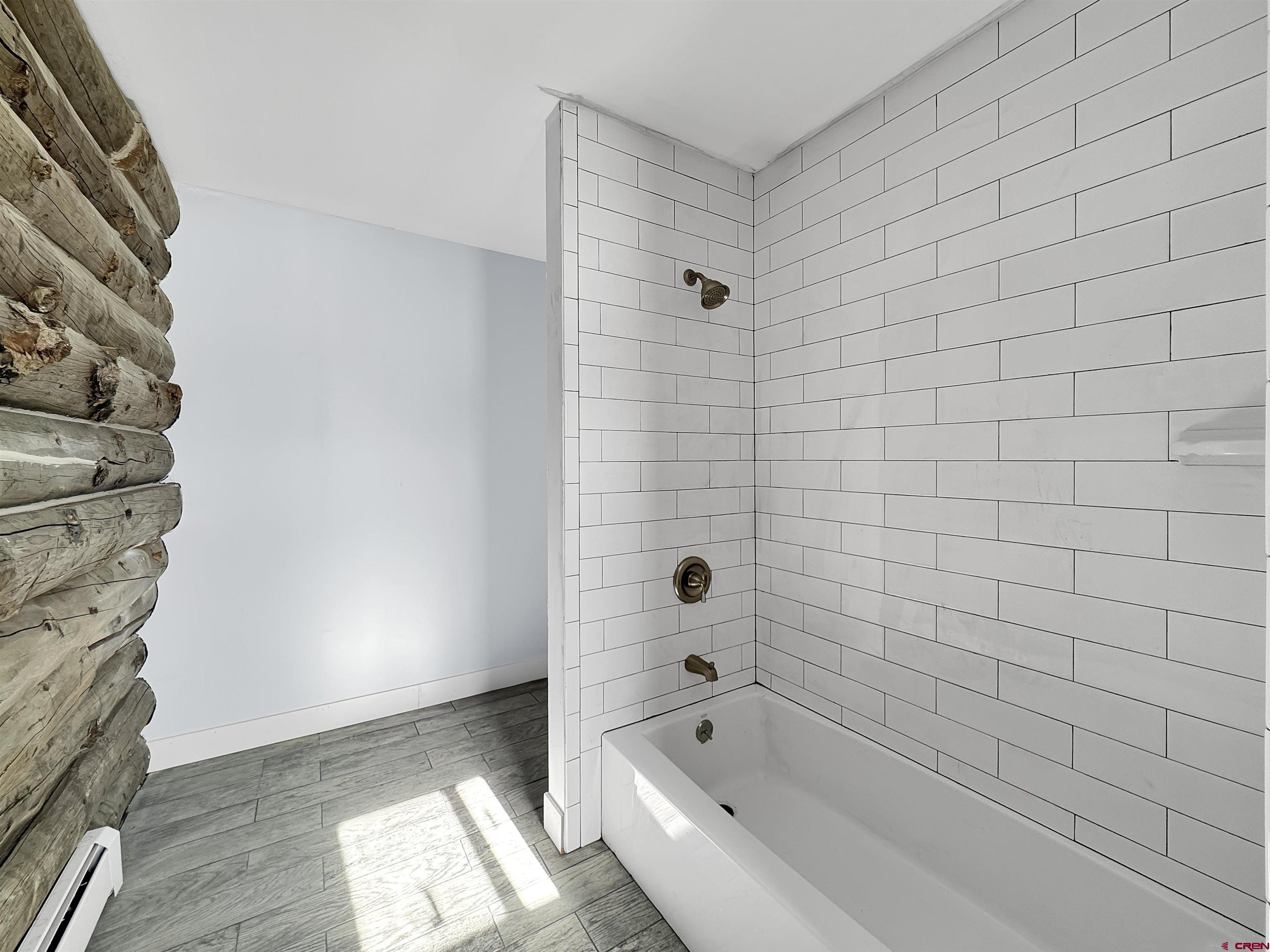 6313 Sagebrush Road Hotchkiss, CO 81419 - Photo 20 of 34 a bathroom with a bathtub and shower