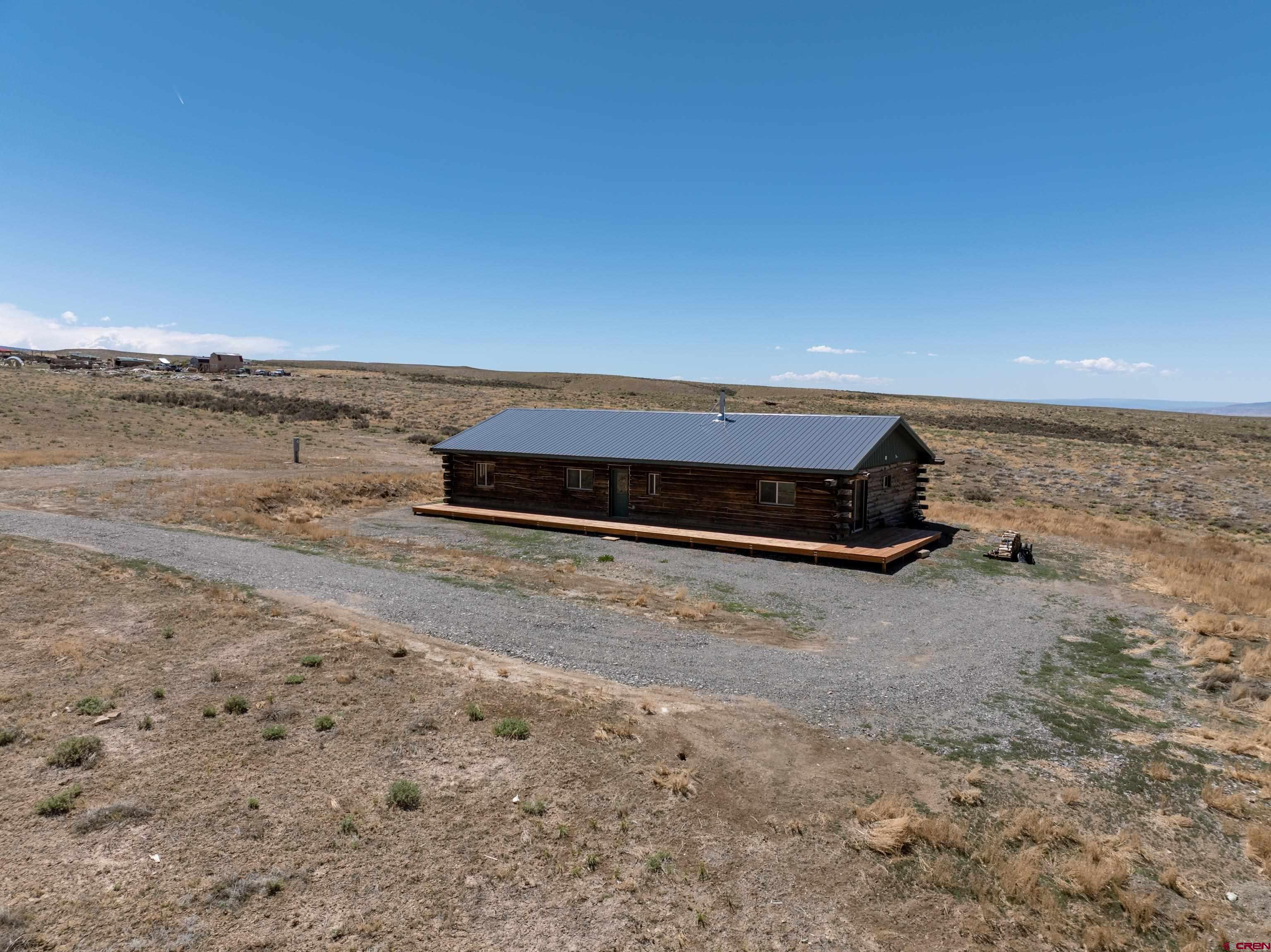 6313 Sagebrush Road Hotchkiss, CO 81419 - Photo 29 of 34 a view of a dry yard with wooden fence