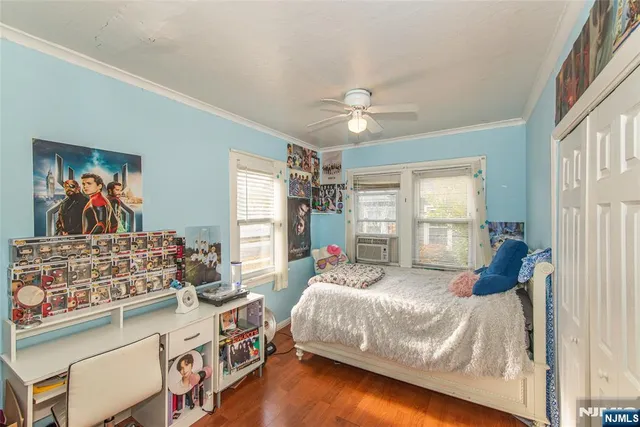 a bed room with a bed and a window